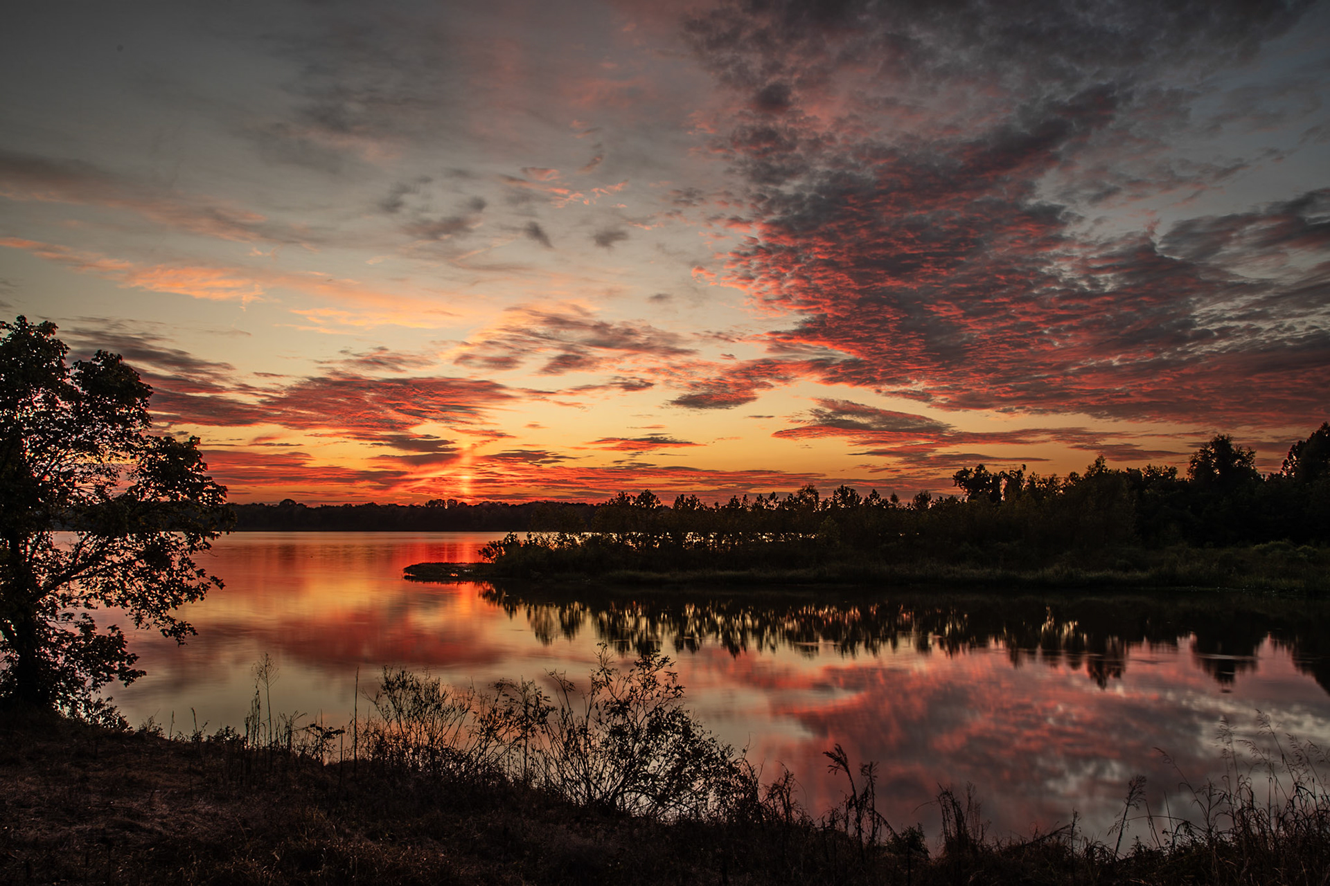 Deep red and orange colored clouds as the sunsets