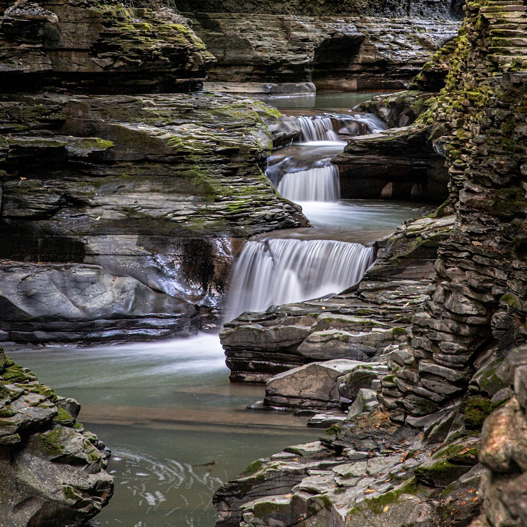 Flowing Cascades against the rocky stream banks in Watkins Glen
