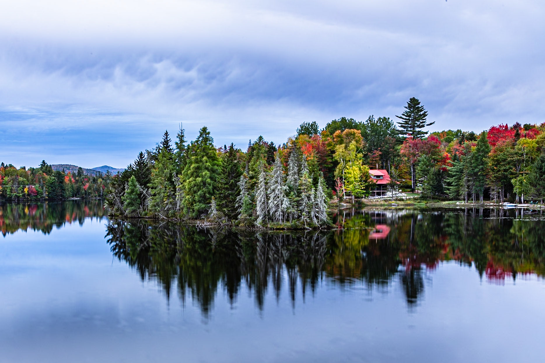 Cabin and trees along Lake Abanakee in the Adirondacks