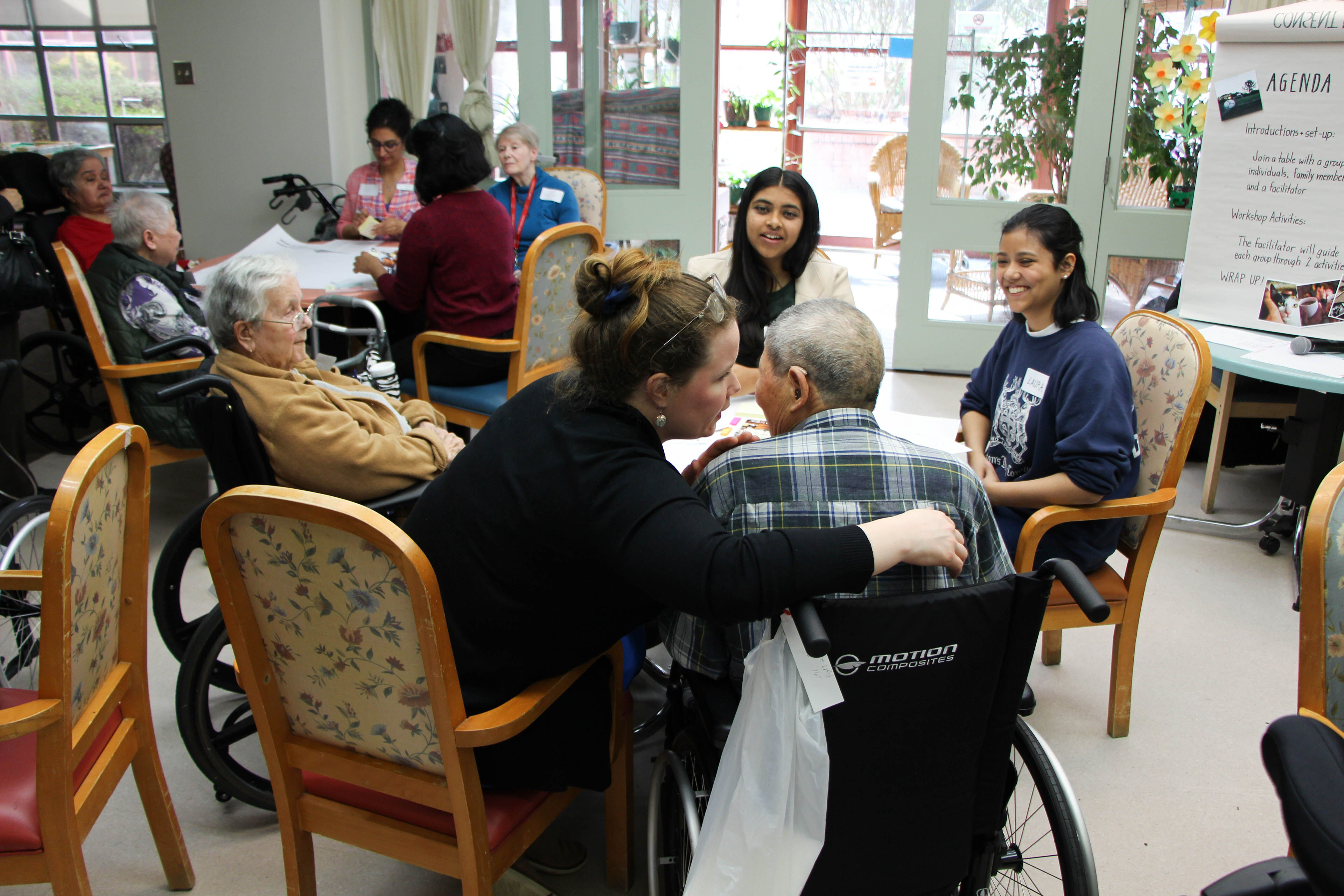 A VCH member helps the team communicate with a resident.