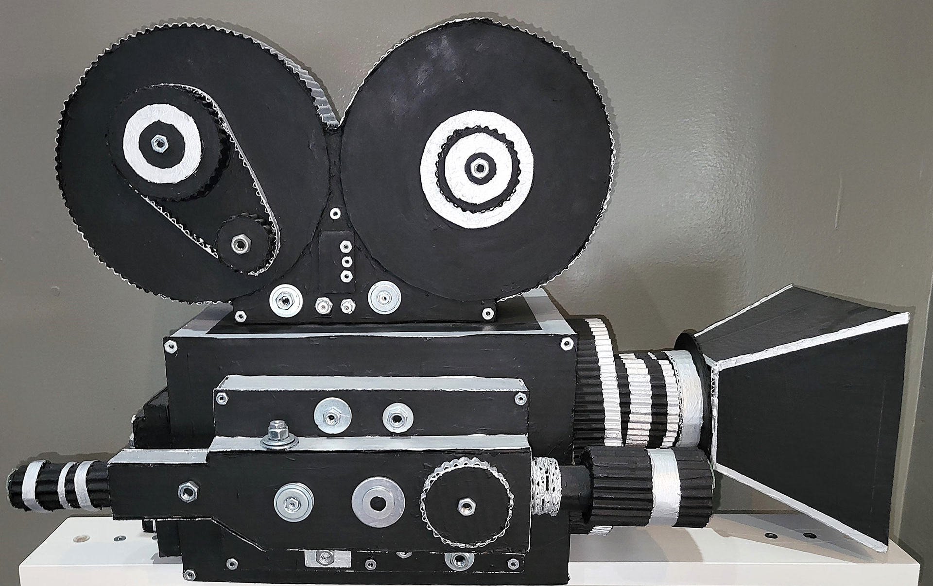 Movie Projector Sculpture (Cardboard, CD's, Acrylic paint, Nuts, and Washers)