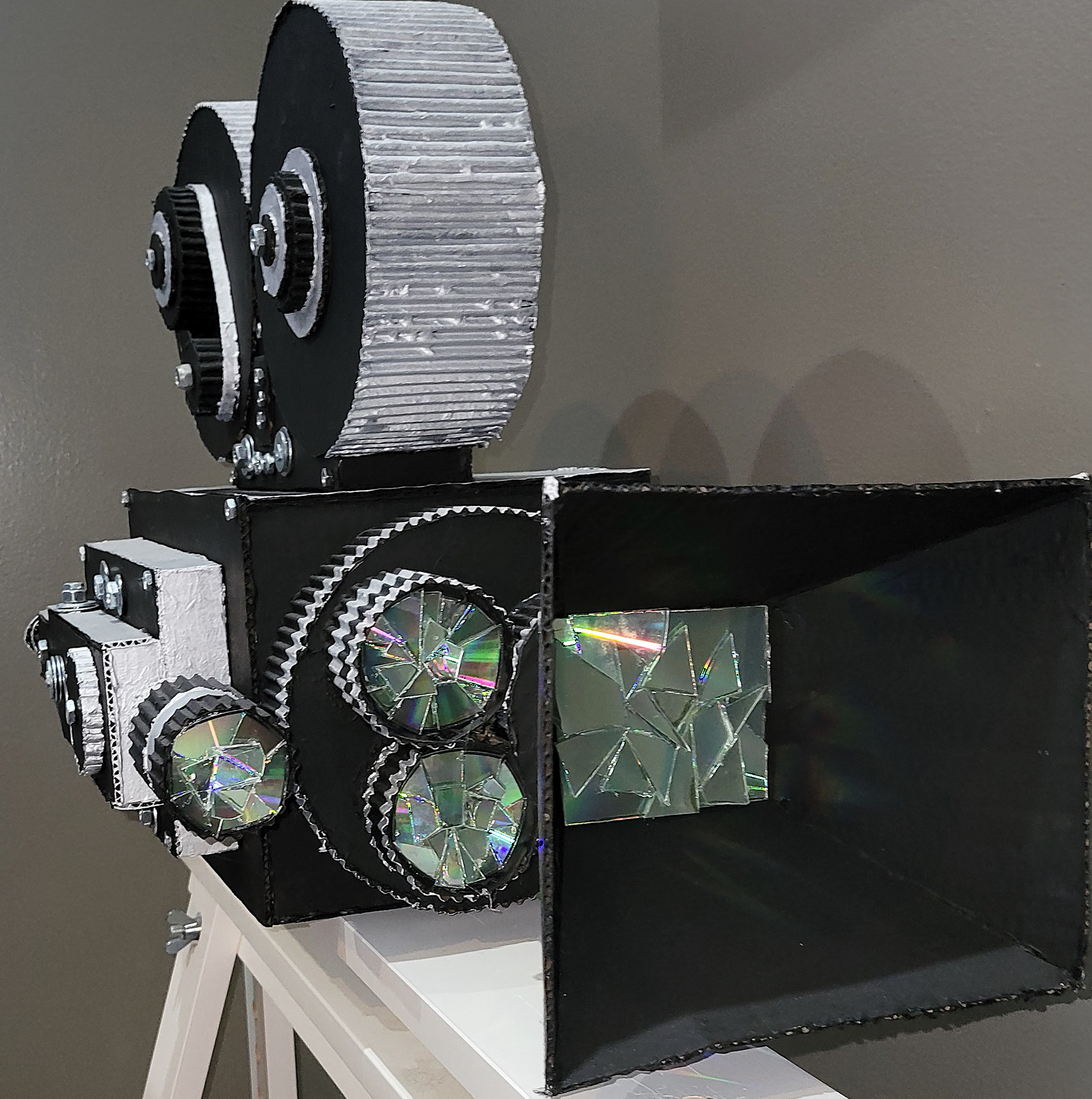 Movie Projector Sculpture (Cardboard, CD's, Acrylic paint, Nuts, and Washers)