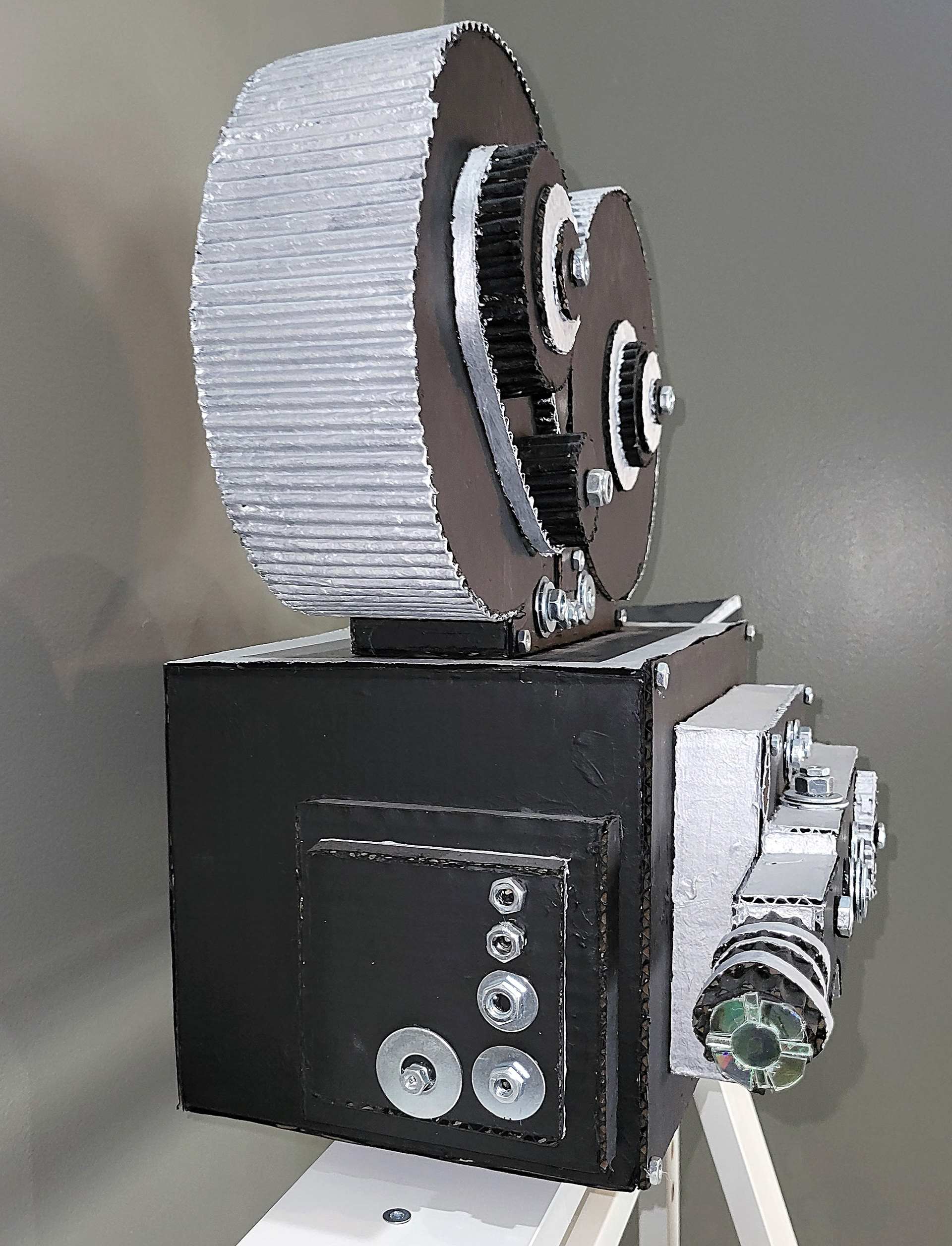 Movie Projector Sculpture (Cardboard, CD's, Acrylic paint, Nuts, and Washers)
