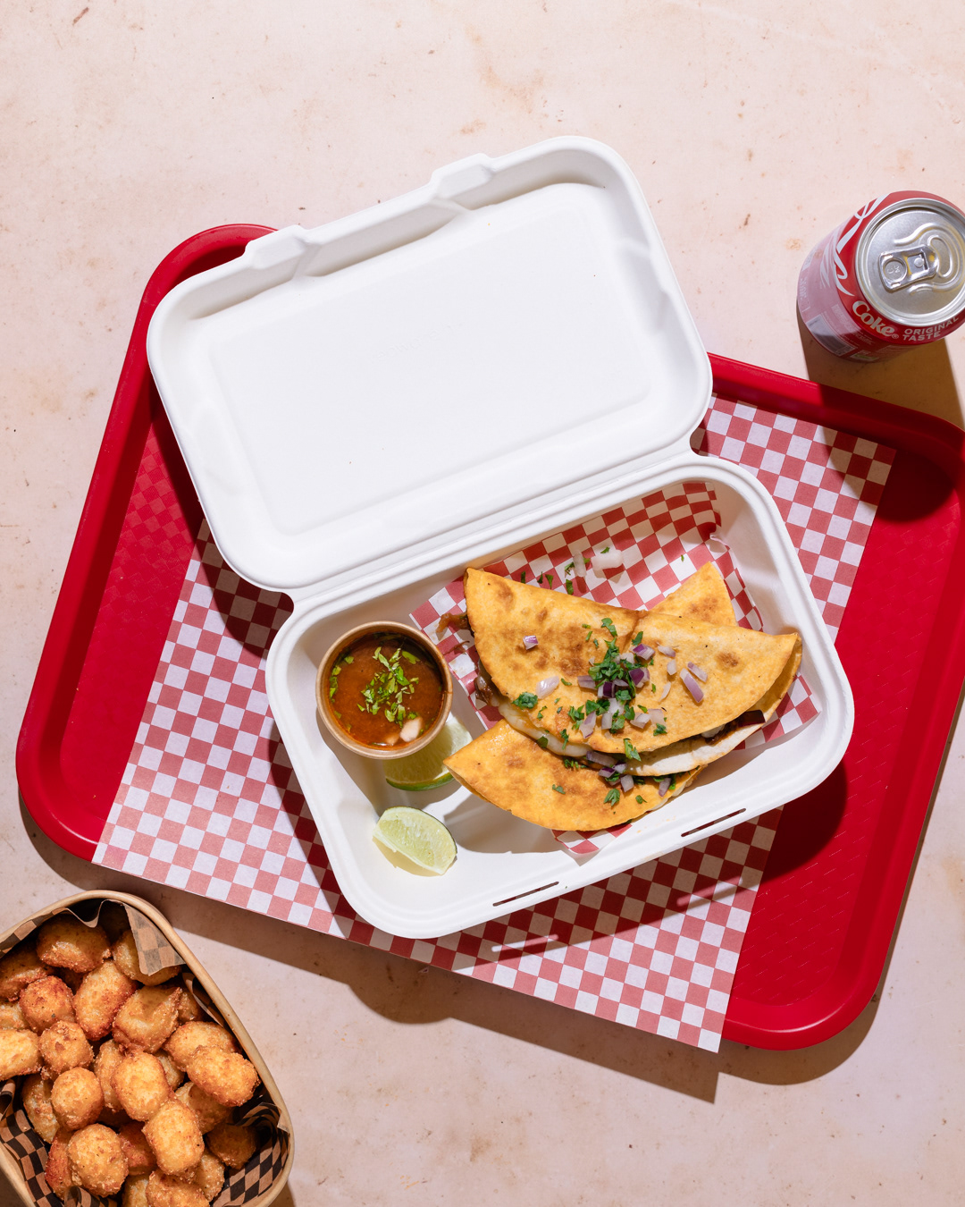 A restaurant photography image of Birria tacos on a take away box made by Federica Melania Orsini - a restaurant photographer in London