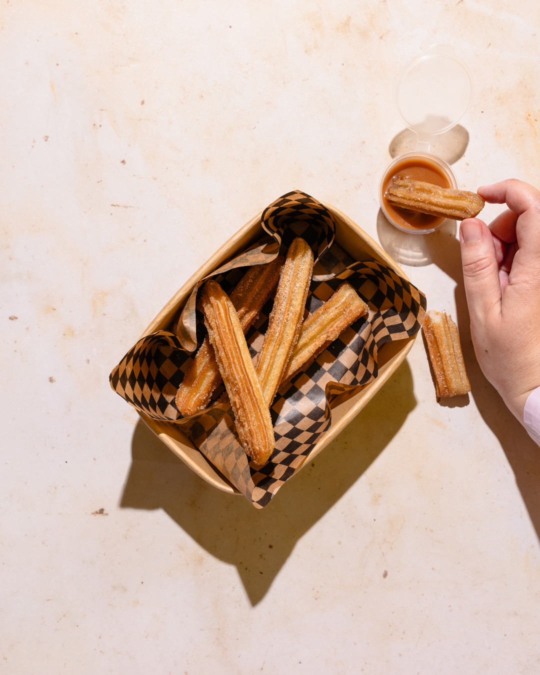 A restaurant photography image of churros made by Federica Melania Orsini - a restaurant photographer in London