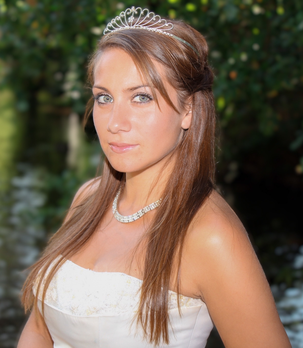 Bride with trees and river in the background