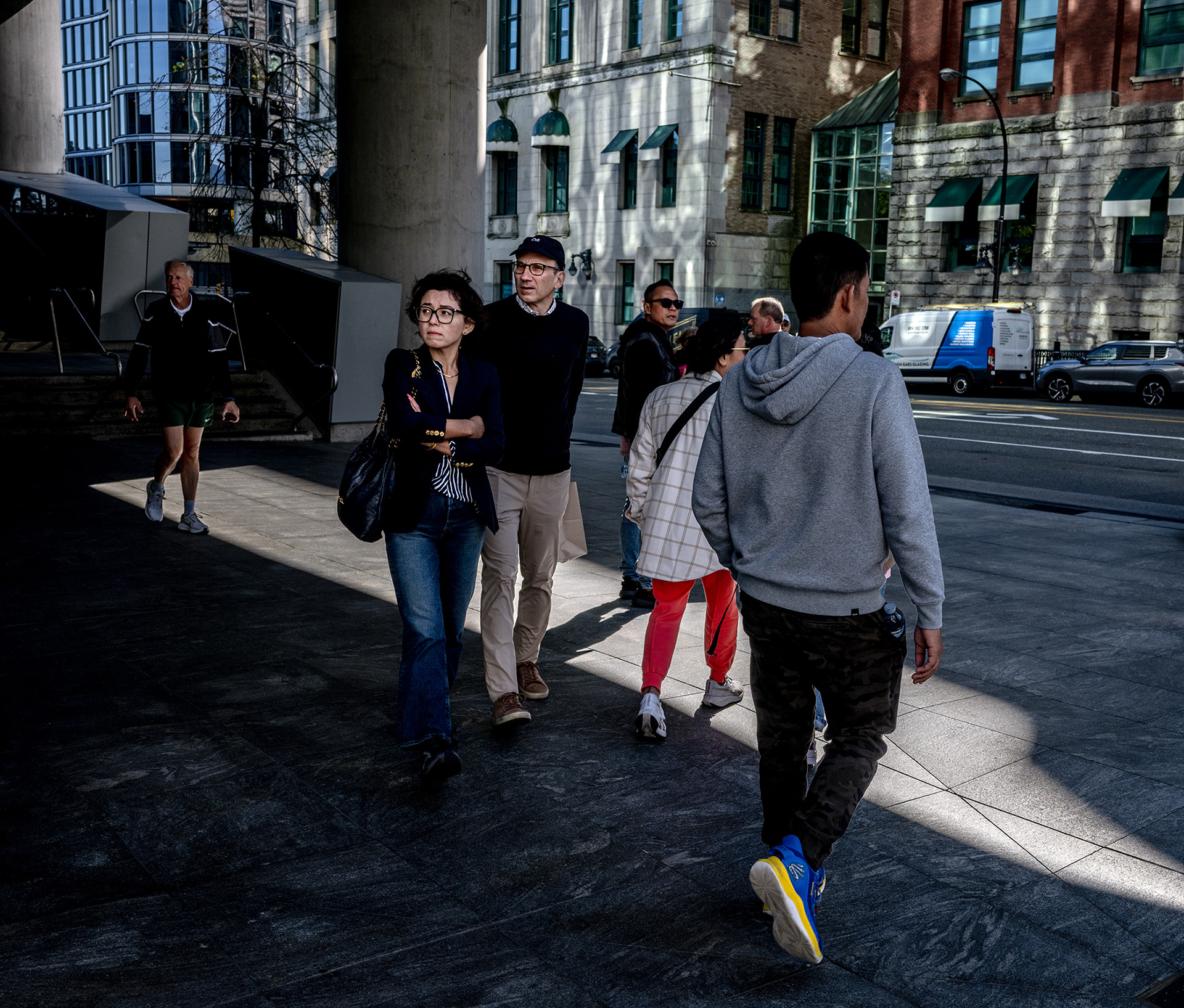 A couple aware of something as yet described, Euro tourists in strolling in Vancouver.