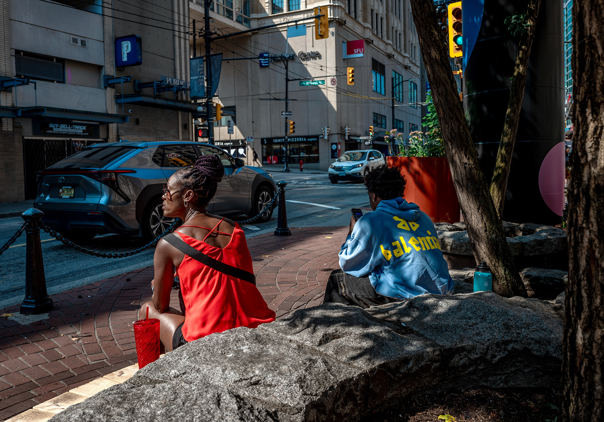 Sunny summer day, sister and brotherwaiting in the sun, bright colors in the siblings and in the background.