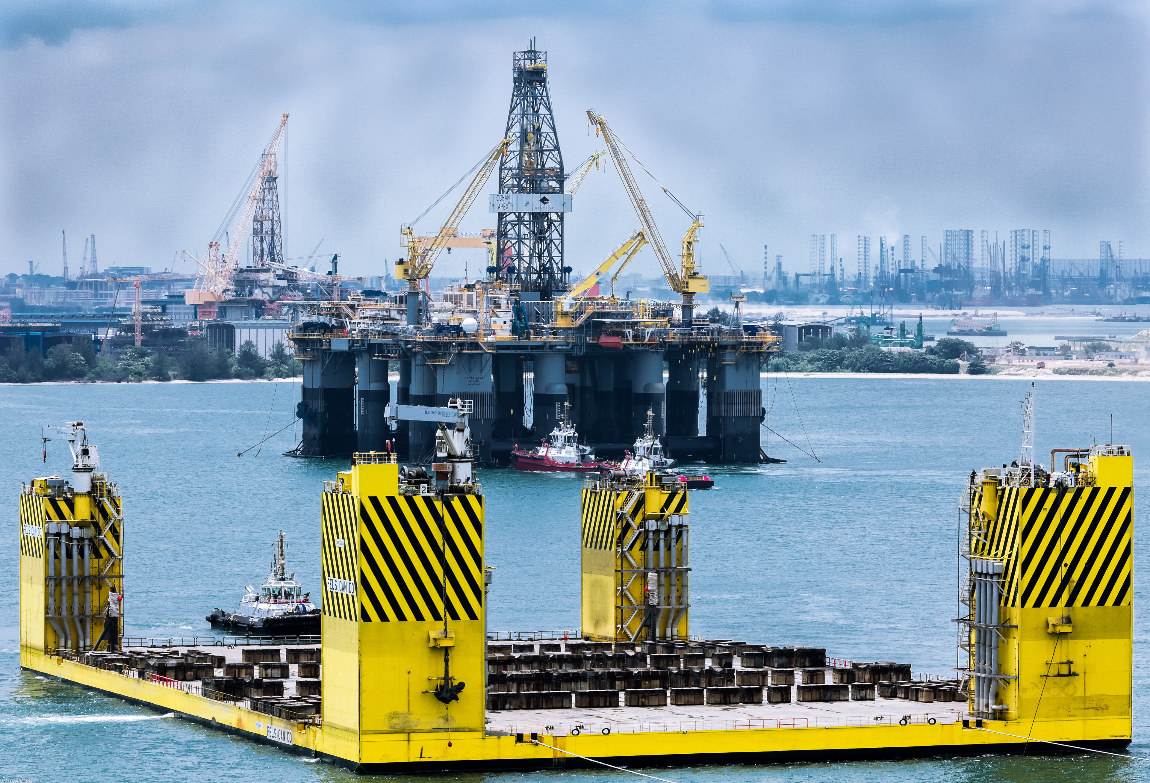 Diamond Drilling Semi Submersible Ocean Apex preparing to float off from barge