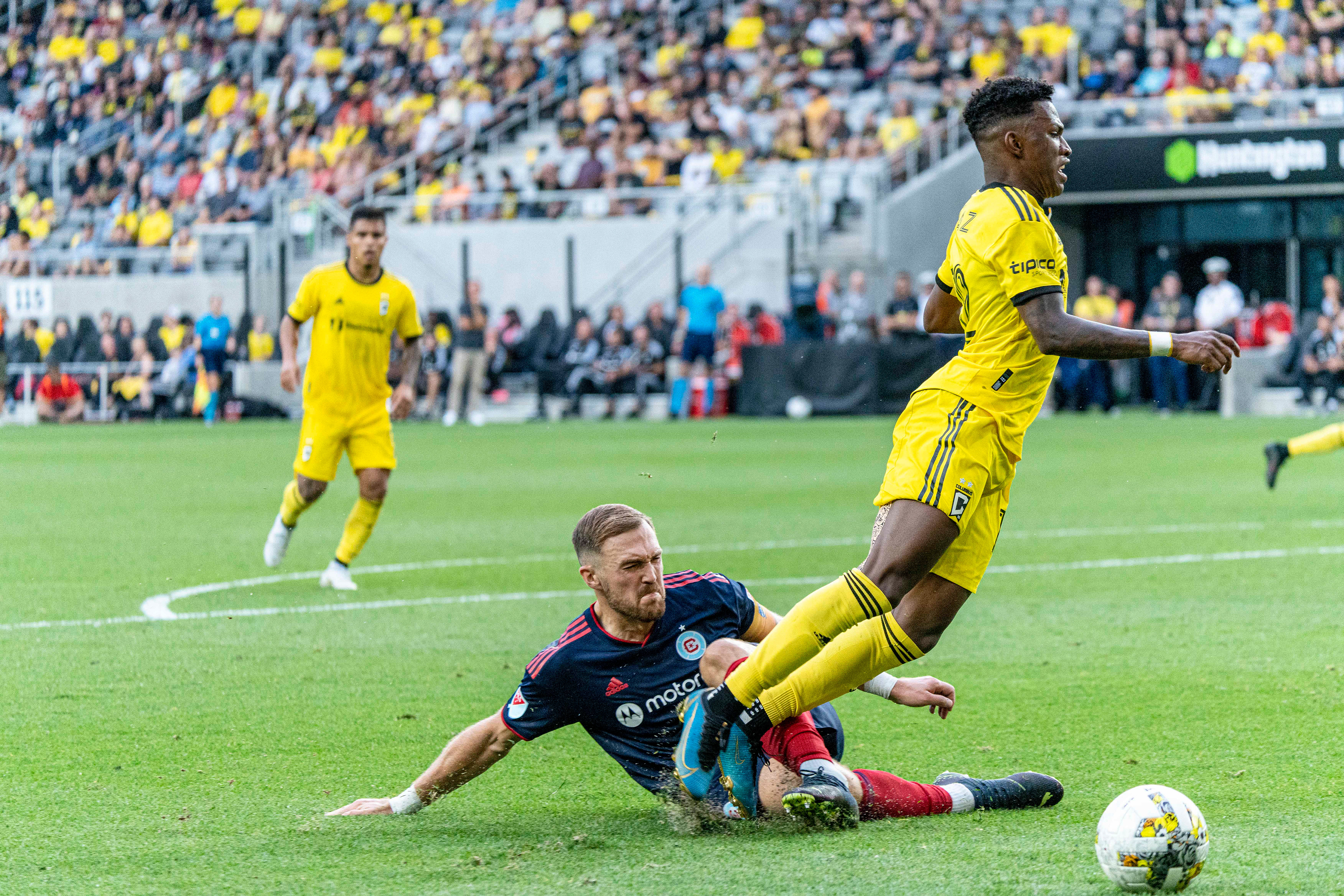 Chicago Fire defender RAFAEL CZICHOS (5) slide tackles Columbus Crew midfielder LUIS DIAZ (12) in an attempt to produce a draw at Lower.com Field.