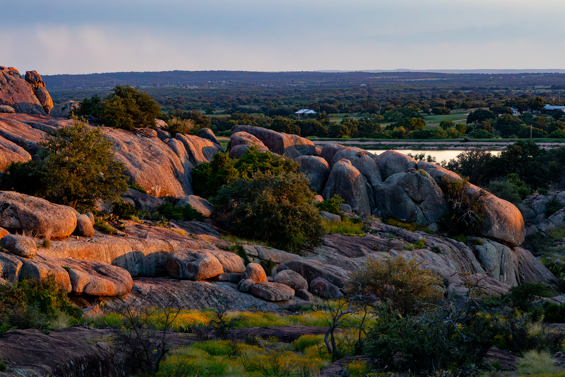 A sun-kissed granite outcrop overlooks Mason Mountain Wildlife Management Area in Mason County, Texas.