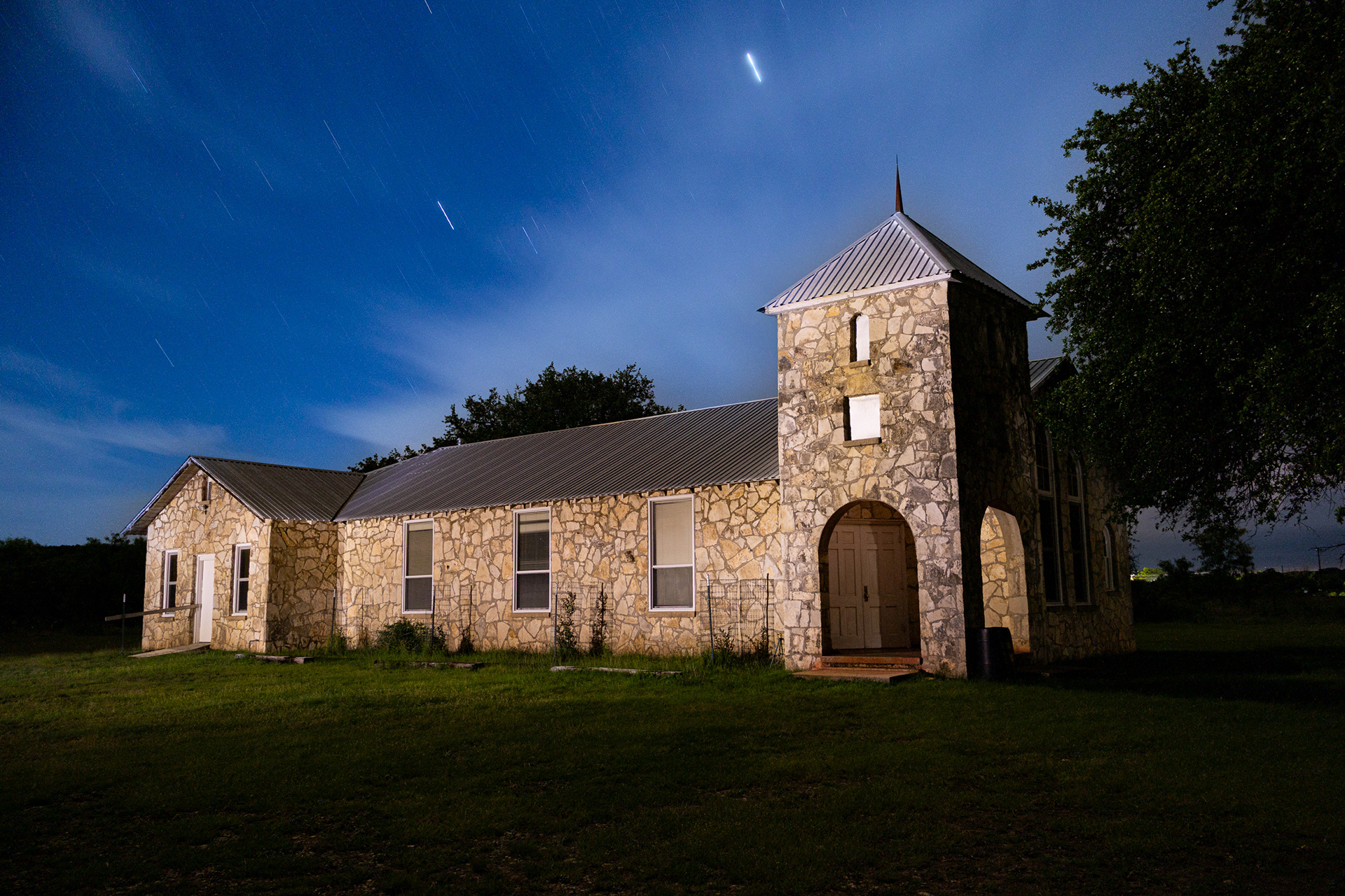Roosevelt Presbyterian Church sits under a starry night sky in Roosevelt, Texas.