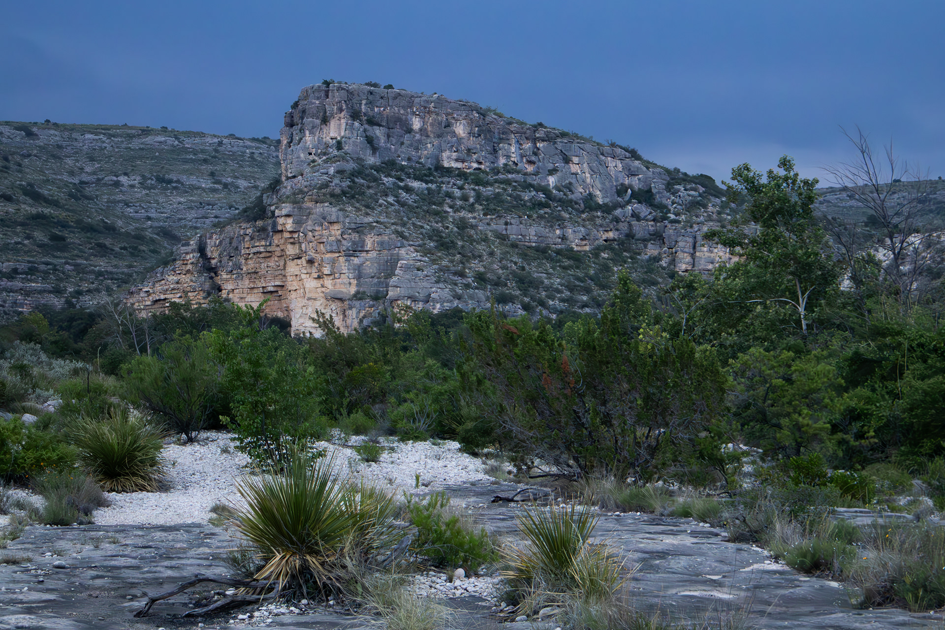 A rock formation towers in the late evening near Dolan Creek, a tributary of Devils River in Val Verde County, Texas.