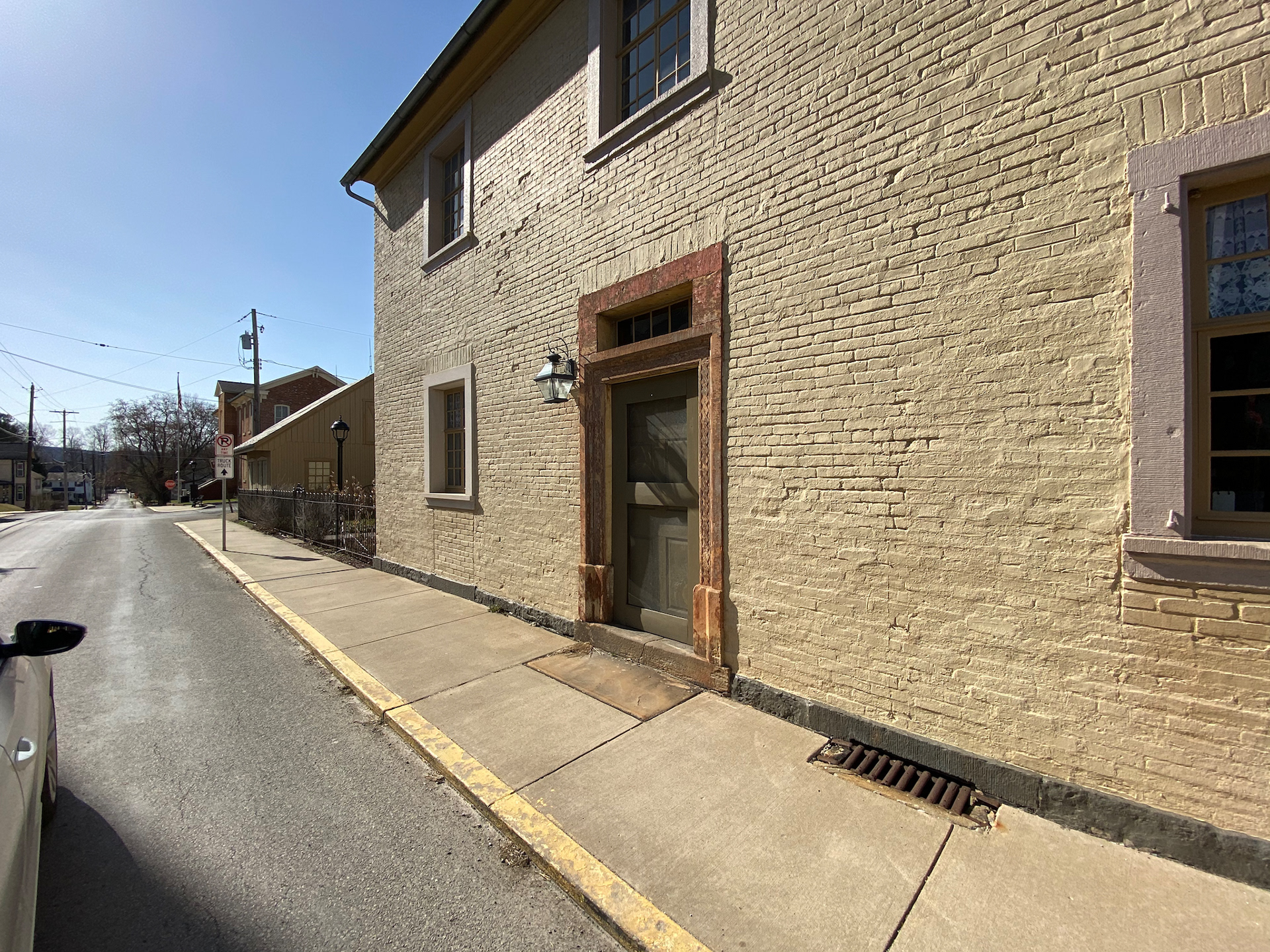 Pale yellow Brick building in town center