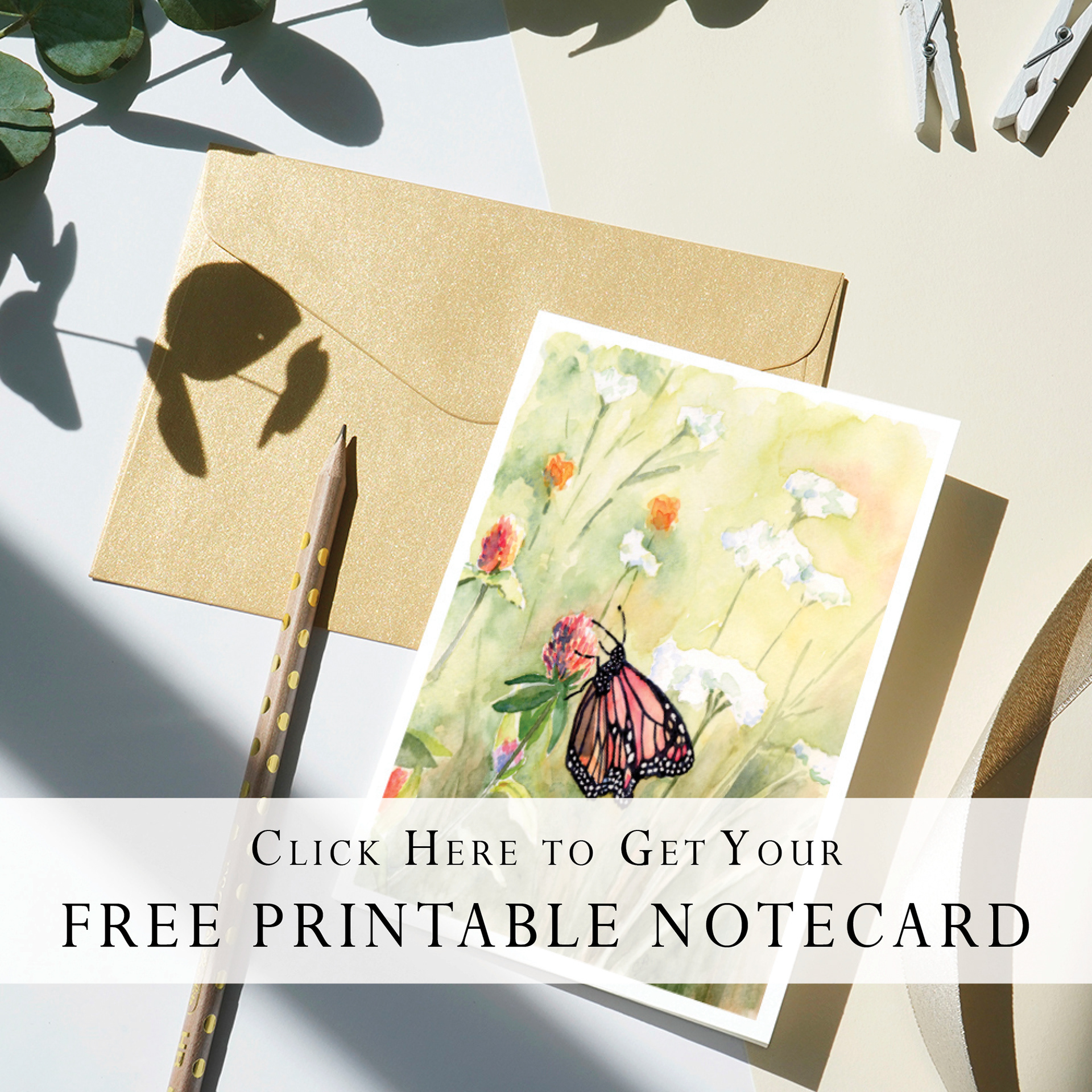 Photo of butterfly watercolor painting on a greeting card with a pencil & envelope