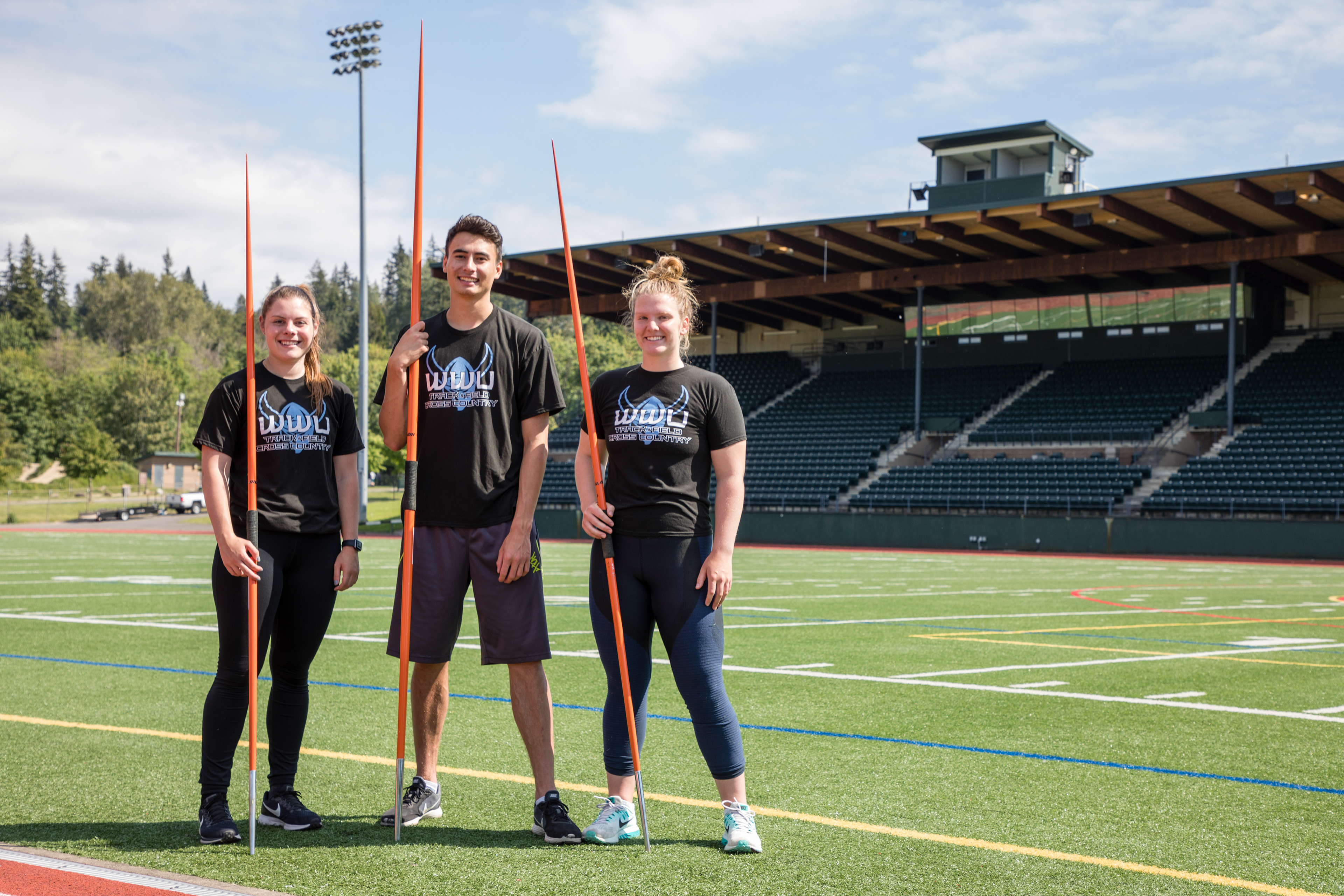 Freshman Natalie Vetto, junior Alex Barry and sophomore Raquel Pellecer pose for a portrait at Civic Stadium. The three javelin throwers competed in the NCAA DII National Championship for Western Washington University. 