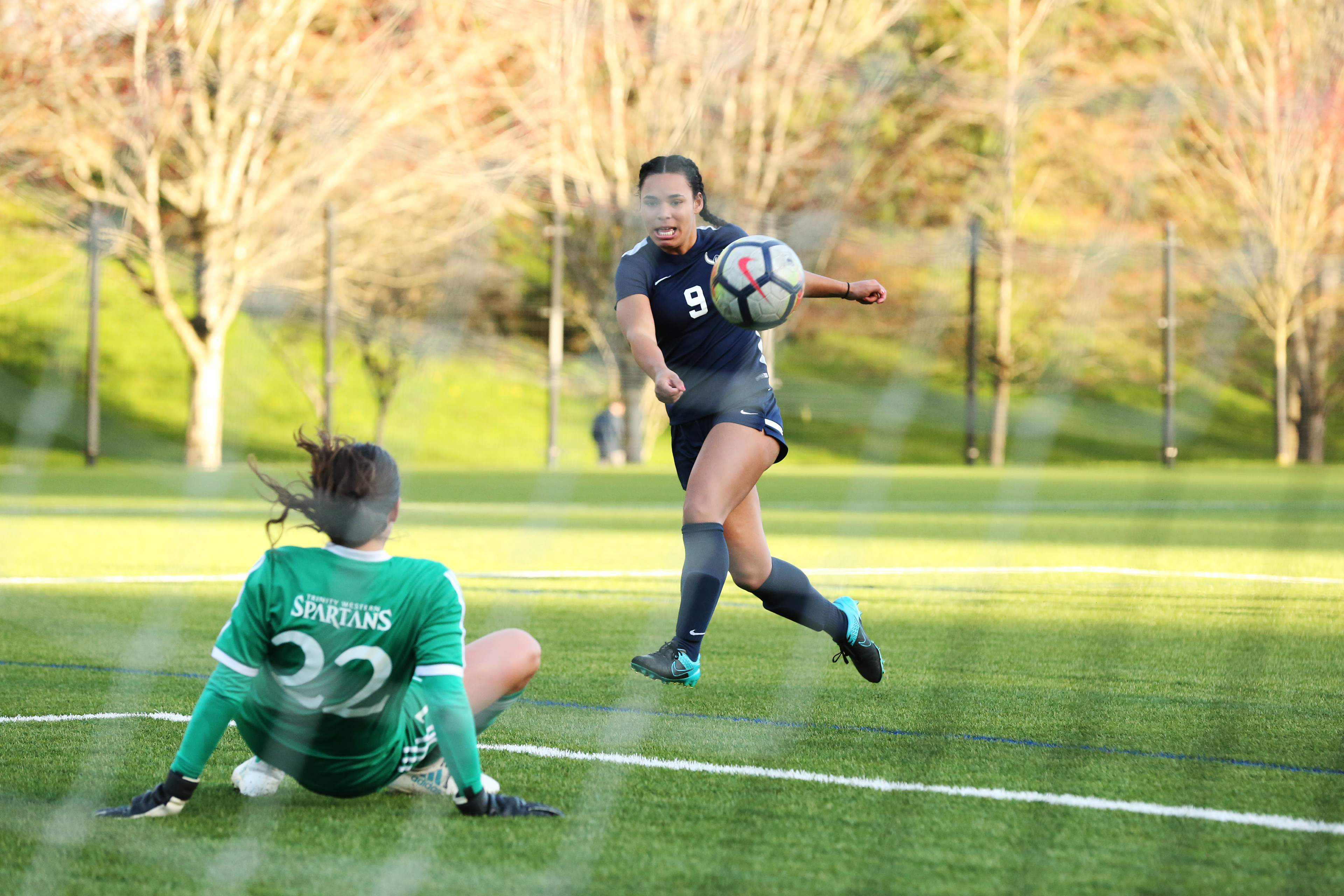 Junior Gabriela Pelogi takes a shot on goal against Trinity Western on Apr. 10, 2018. The friendly ended in a 1-1 draw.