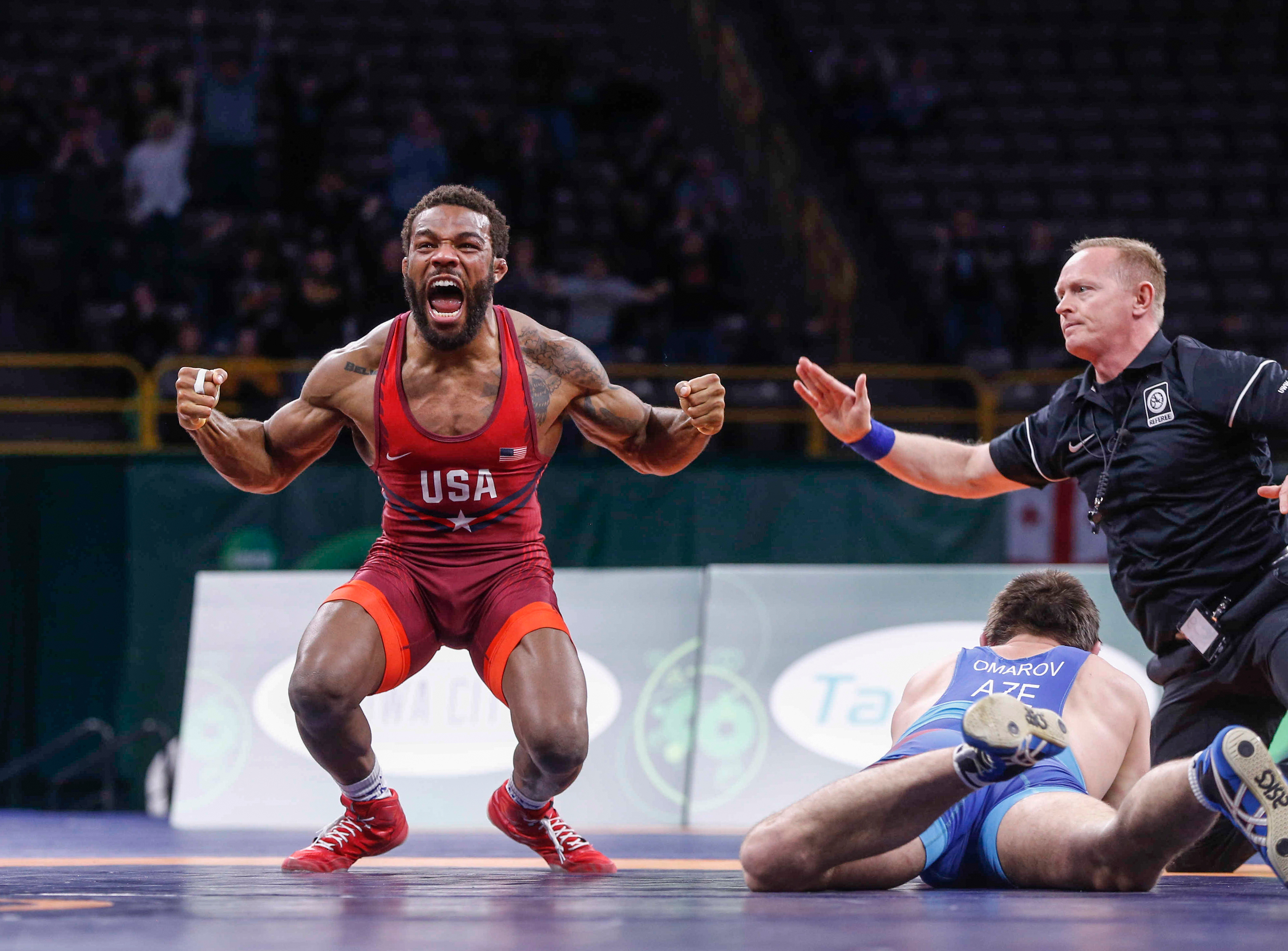 Jordan Burroughs celebrates after pinning Gasjimurad Omarov of Azerbaijan during the freestyle wrestling World Cup in Iowa City on Sunday, April 8, 2018. The win helped Team USA to a 6-4 gold medal win over Azerbaijan.