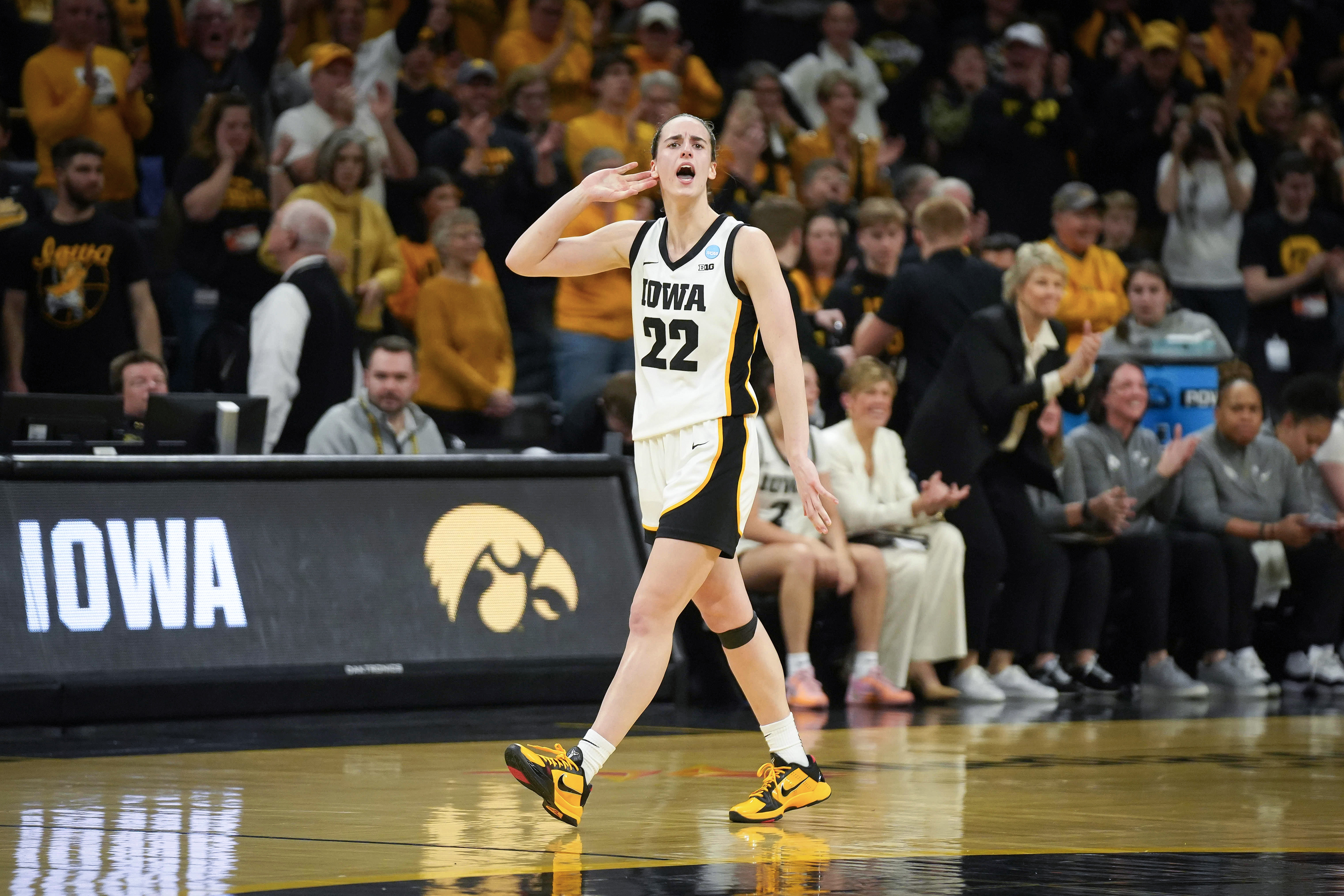 IOWA CITY, IOWA - MARCH 25: Caitlin Clark #22 of the Iowa Hawkeyes reacts after scoring a field goal against the West Virginia Mountaneers during the second round of the 2024 NCAA Women's Basketball Tournament held at Carver-Hawkeye Arena on March 25, 2024 in Iowa City, Iowa. (Photo by Bryon Houlgrave/NCAA Photos via Getty Images)