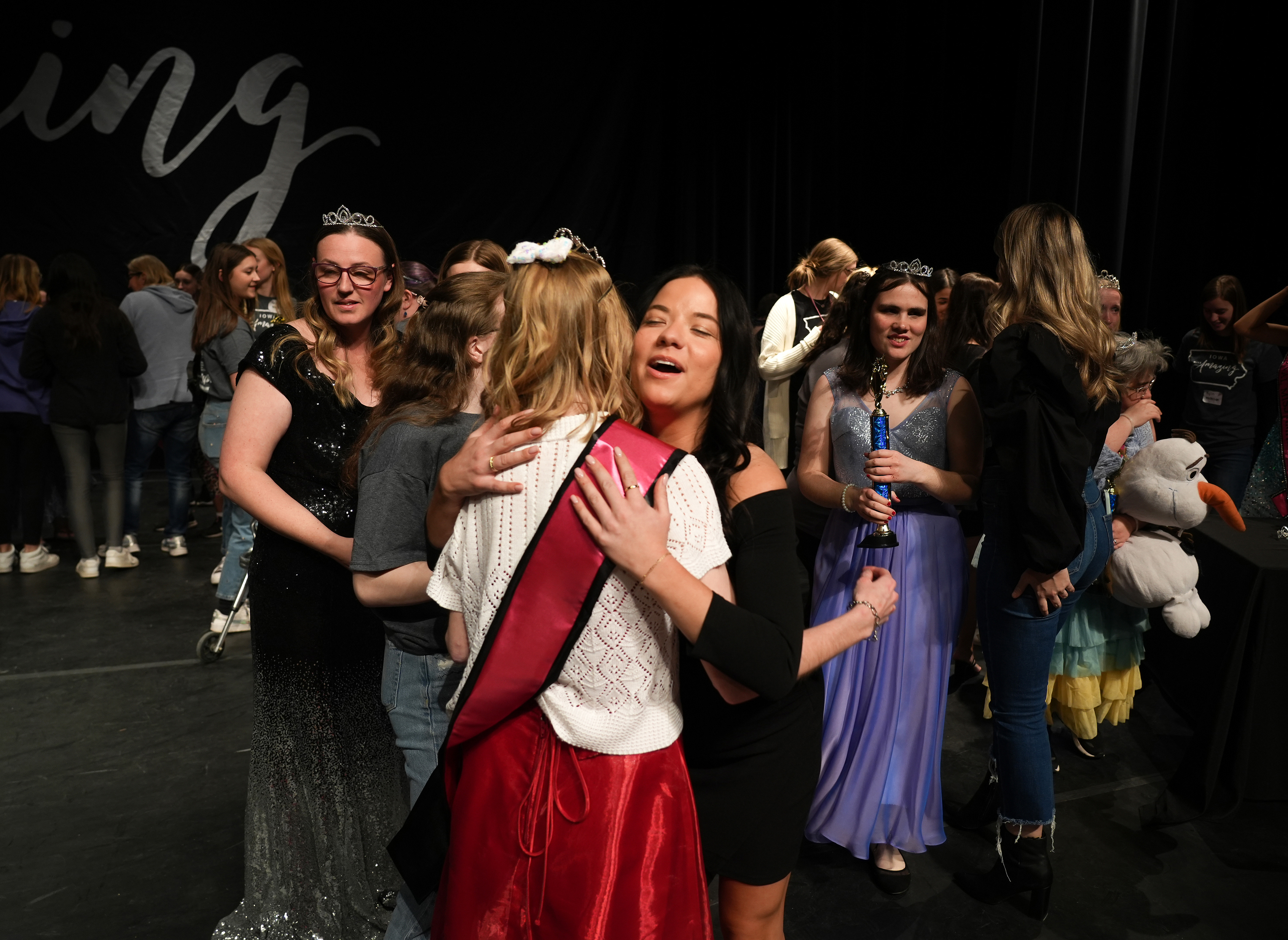 Iowa Miss Amazing co-director Morgan Tooley, right, hugs Carla Lahart at the conclusion of the 11th Annual Iowa Miss Amazing pageant on Saturday, Feb. 4, 2023, in Urbandale, Iowa.