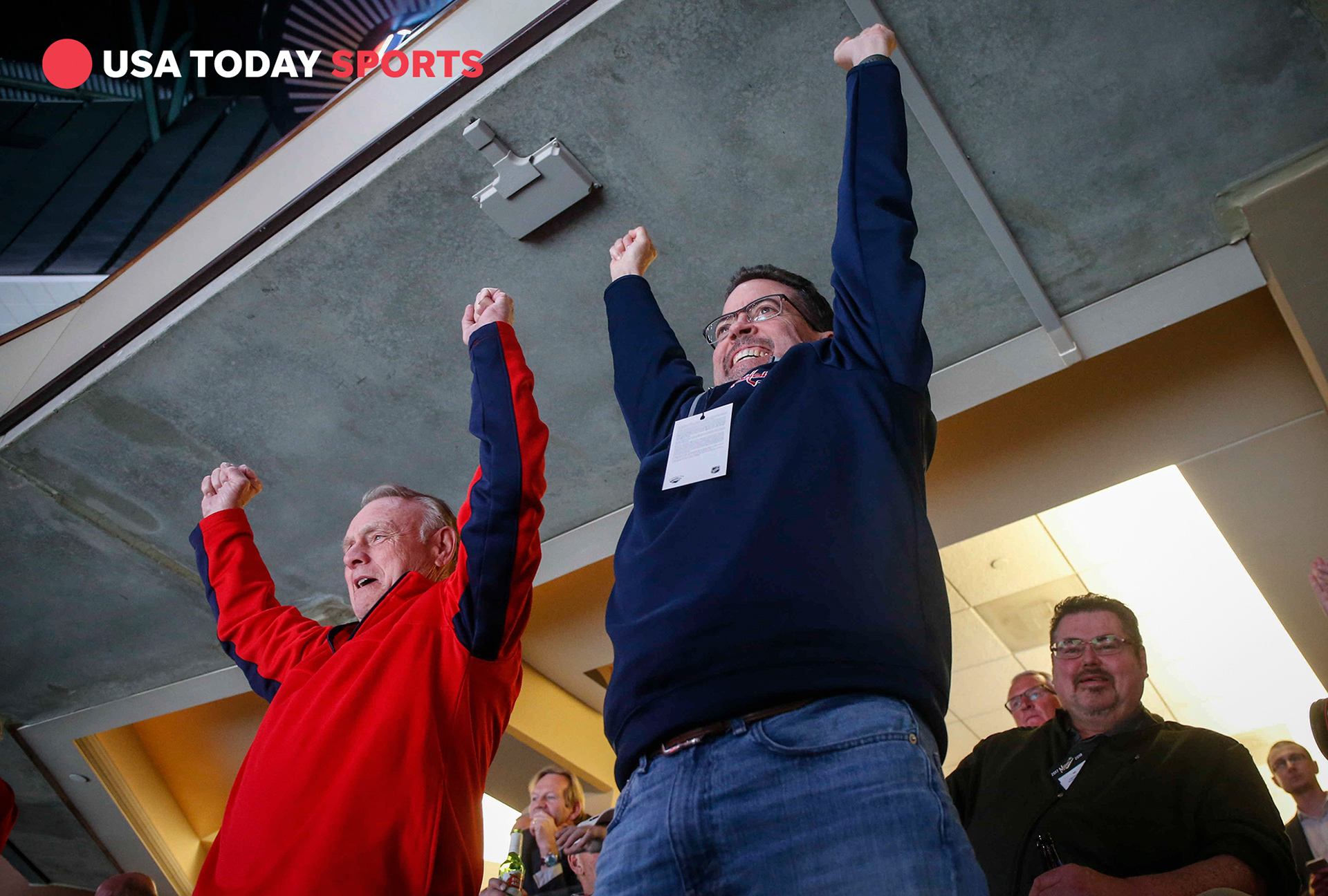 Tom Chalk, right, father of Washington Capitals media relations manager Tommy Chalk, and Eugene Fentress, father-in-law of Capitals broadcaster Ken Sabourin, cheer as the Capitals scored a goal against Minnesota on Thursday, Feb. 15, 2018, in St. Paul, Minn.