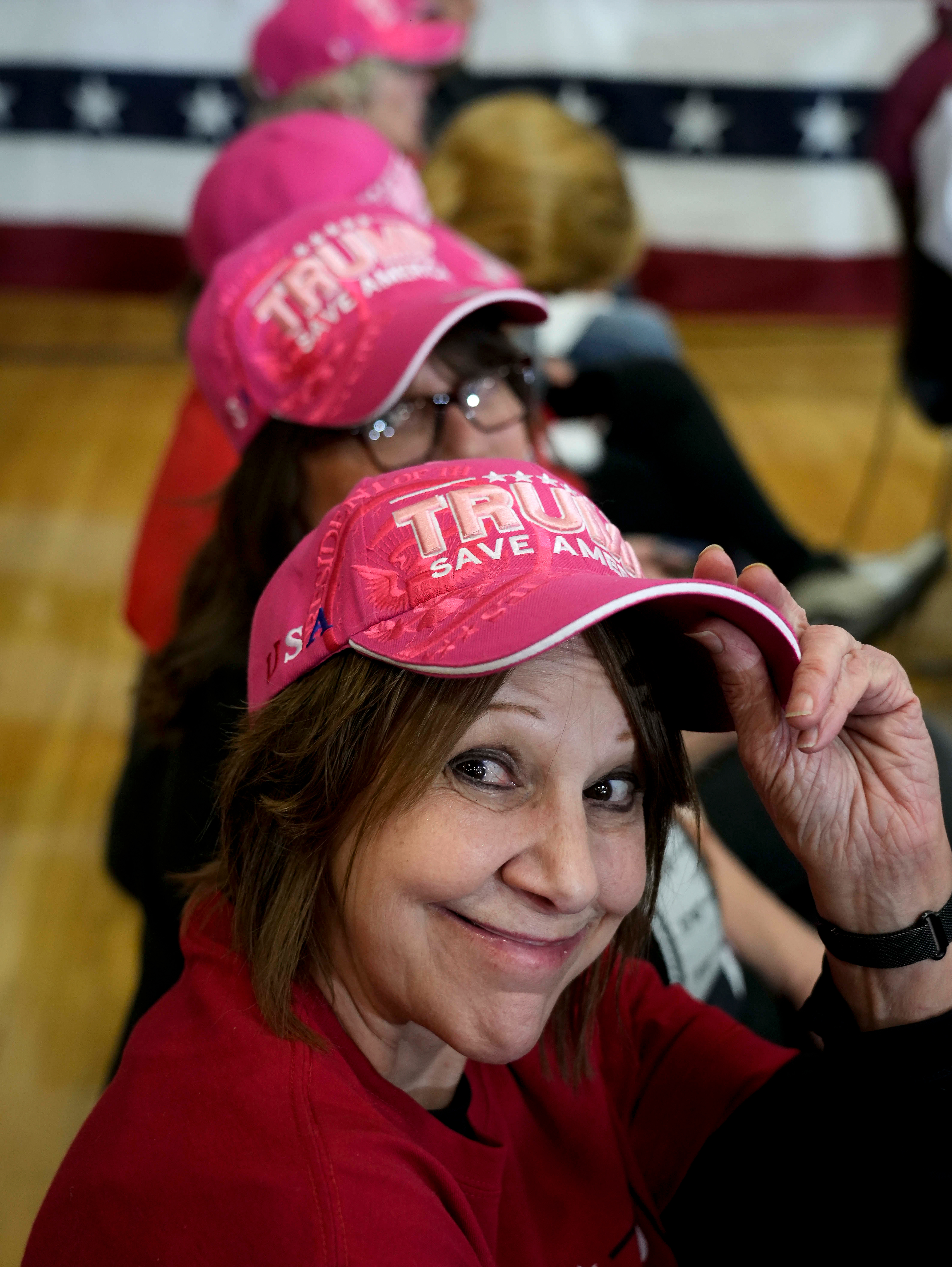 Joyce Bickford of Fort Dodge, Iowa, shows her pink hat while waiting to hear from Republican presidential candidate and former President Donald Trump during a rally Saturday, Nov. 18, 2023, in Fort Dodge, Iowa. (AP Photo/Bryon Houlgrave)