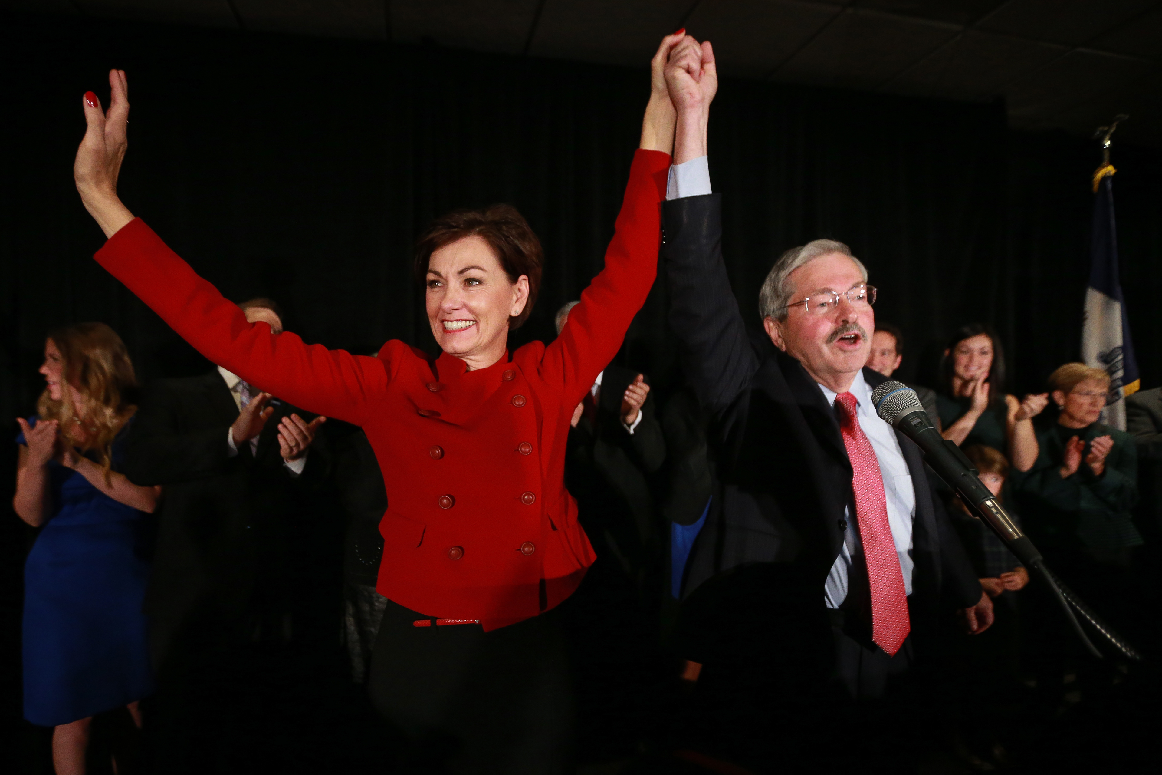 Iowa Gov. Terry Branstad and Lt. Gov. Kim Reynolds celebrate a win by U.S. Senator-elect Joni Ernst on Tuesday, Nov. 4, 2014, at the Marriott Hotel in West Des Moines after Ernst’s win over Bruce Braley.