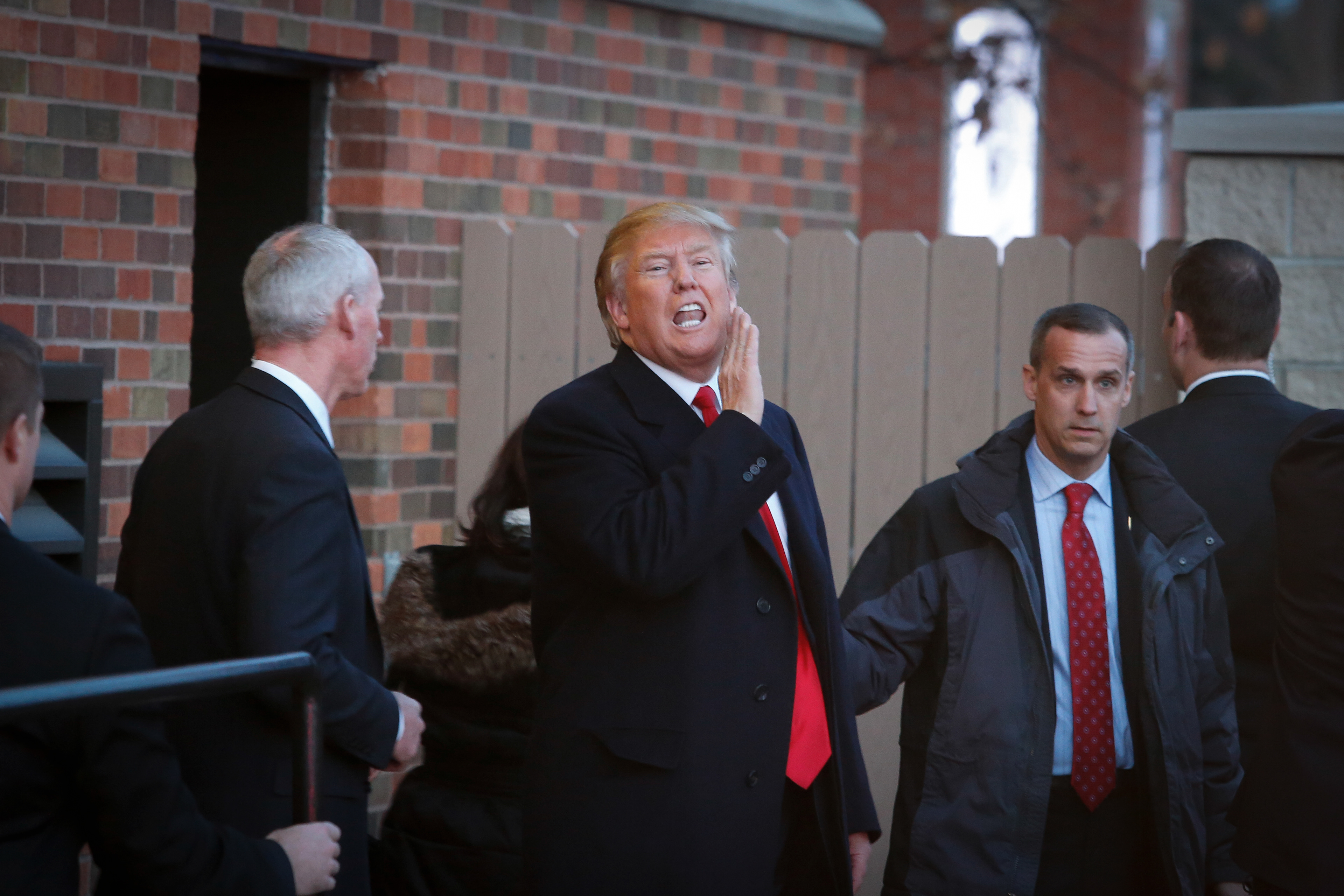 Republican presidential candidate hopeful Donald Trump yells out to supporters during a campaign stop in Winterset, Iowa.