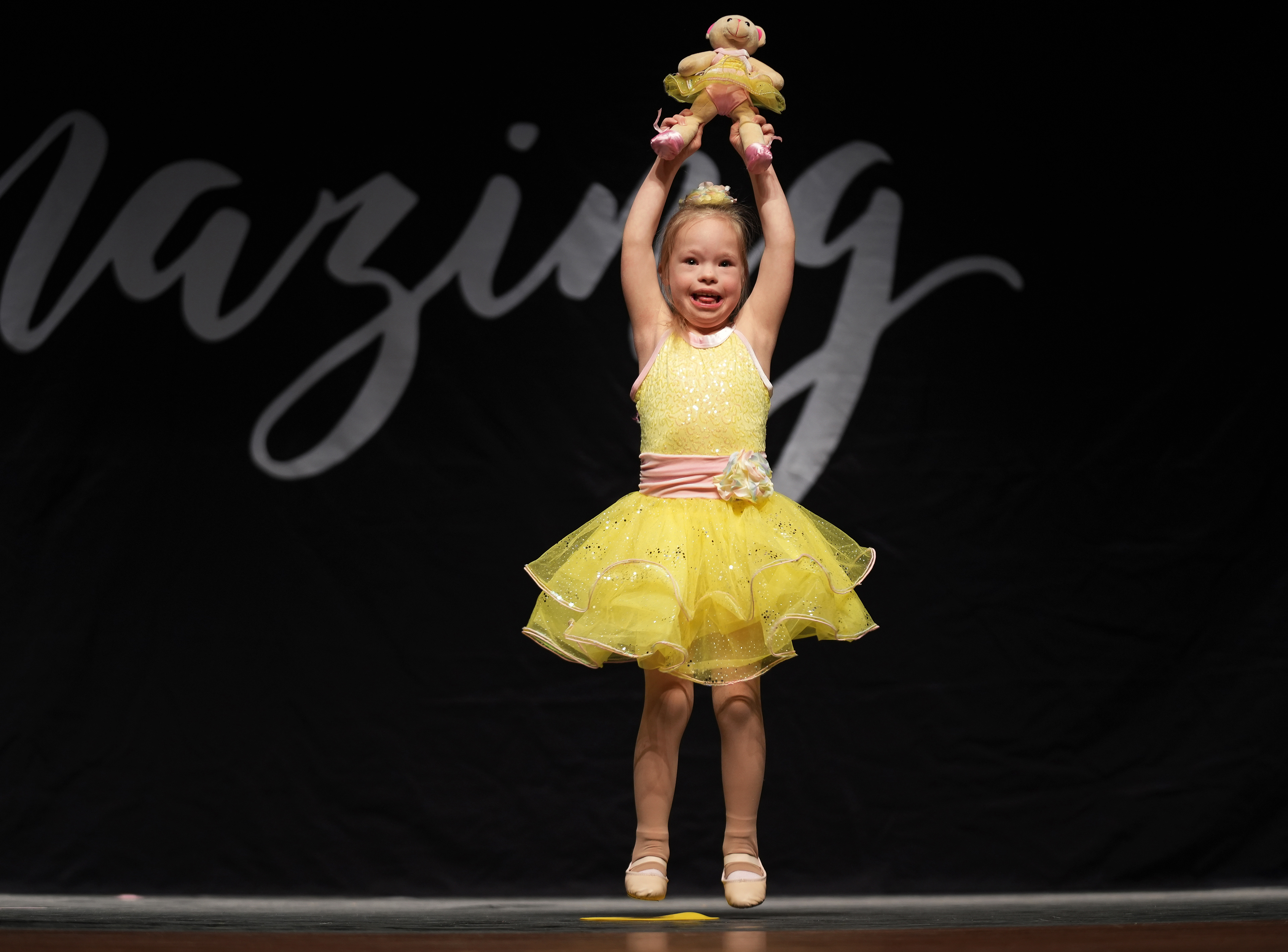 Iowa Miss Amazing rising star participant Ashlyn Mayo performs her passion presentation on stage during the 11th Annual Iowa Miss Amazing pageant on Saturday, Feb. 4, 2023, in Urbandale, Iowa.