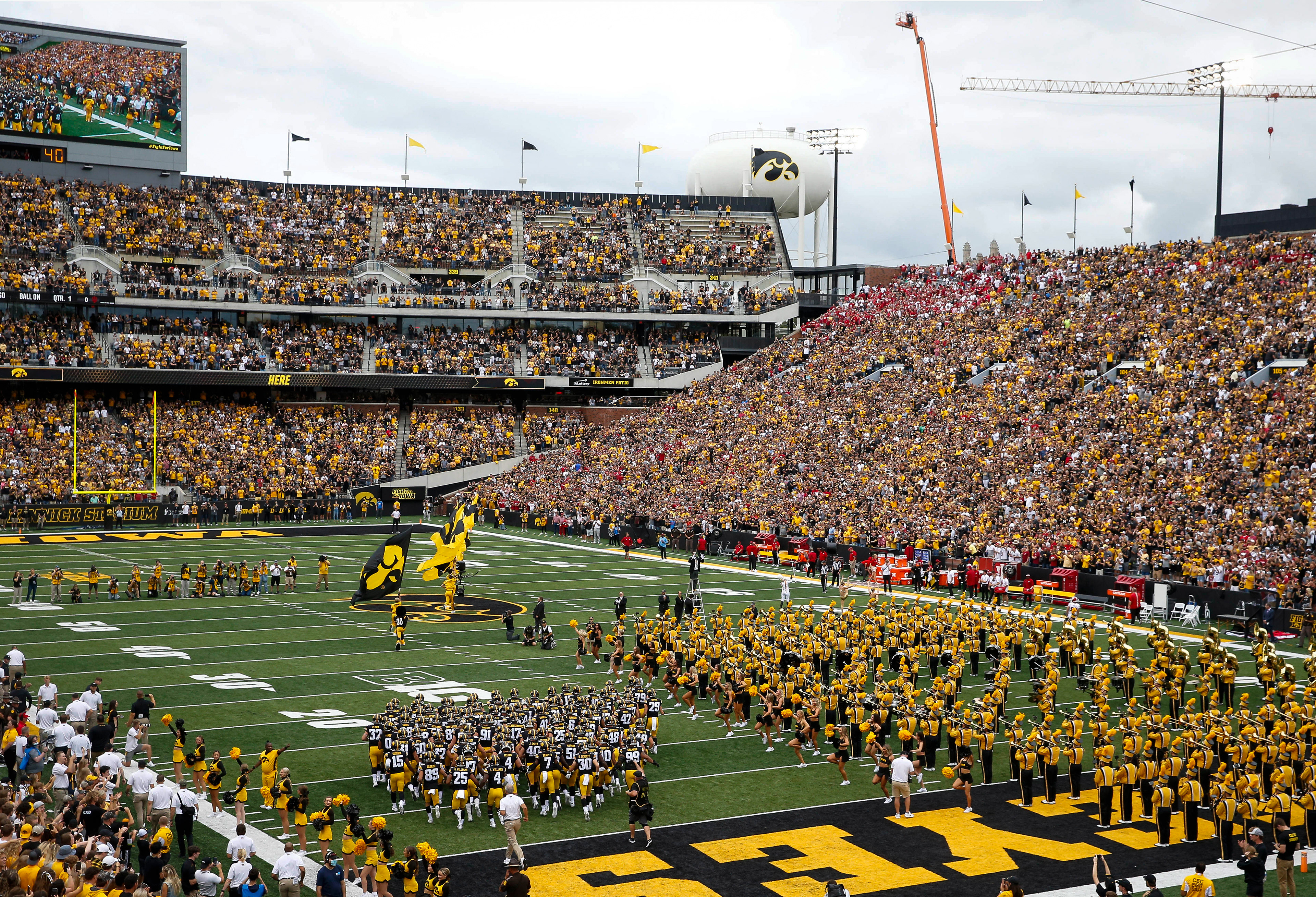 The Iowa Hawkeyes football team takes the field prior to kickoff against Indiana at Kinnick Stadium in Iowa City on Saturday, Sept. 4, 2021.