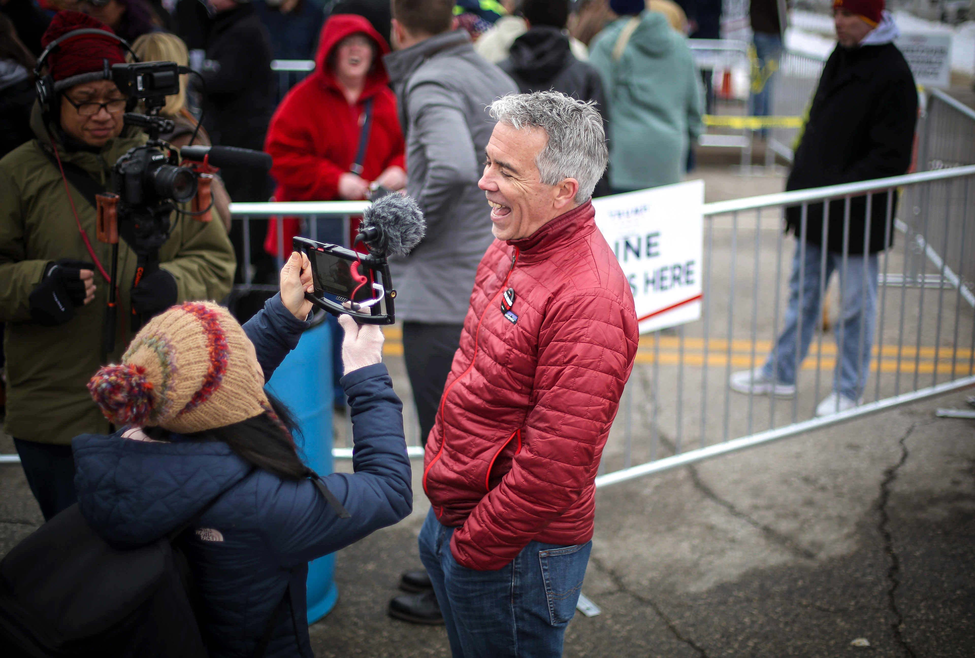 Republican presidential candidate hopeful Joe Walsh speaks to members of the media while visiting with Iowans outside of the Knapp Center, the location of President Donald Trump's Iowa speech, on Thursday, Jan. 30, 2020, at Drake University in Des Moines.