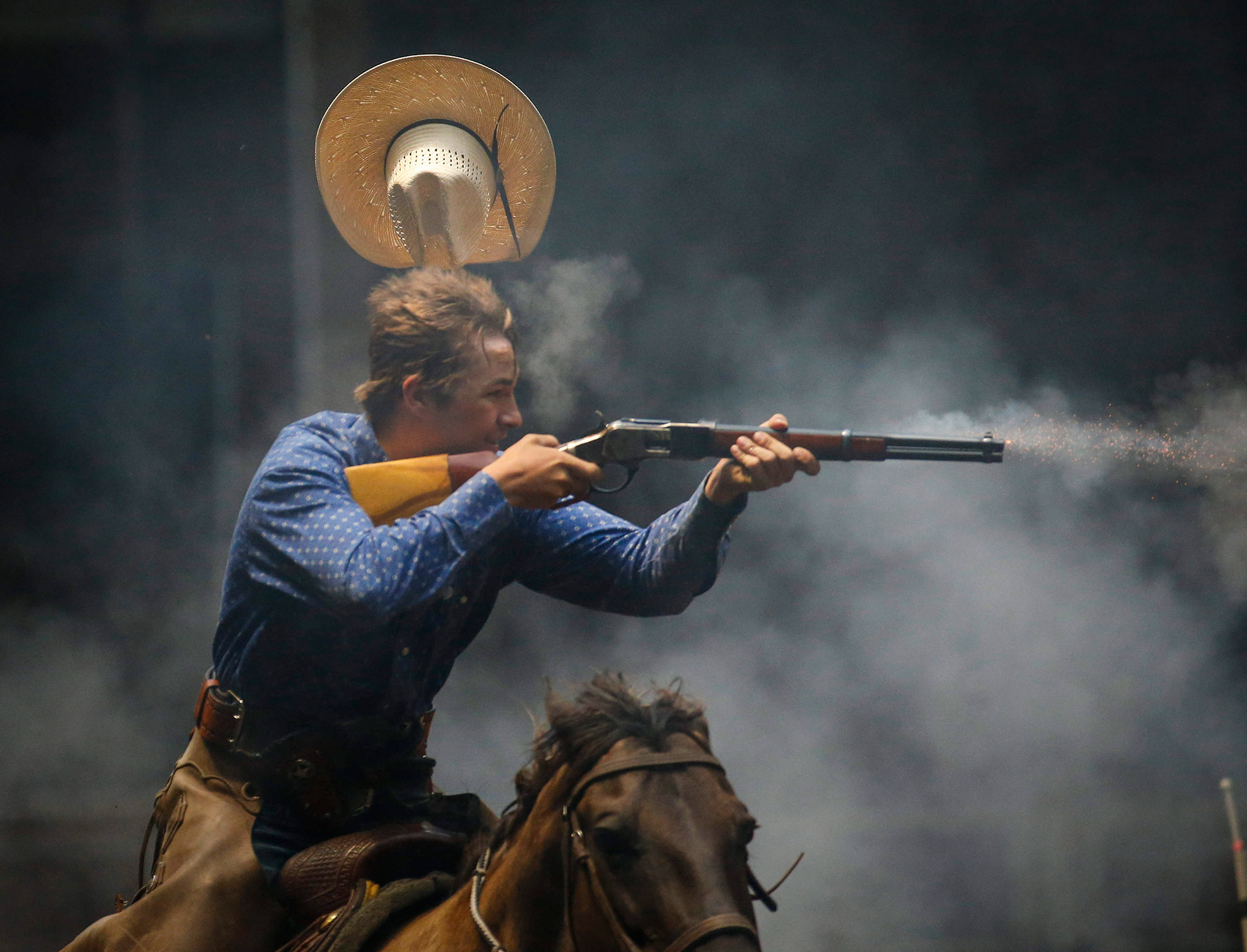 Tristan Travis of Creston blasts his shotgun during Cowboy Mounted Shooting event at the Iowa State Fair on Friday, Aug. 9, 2019, at the Iowa State Fairgrounds in Des Moines. 
