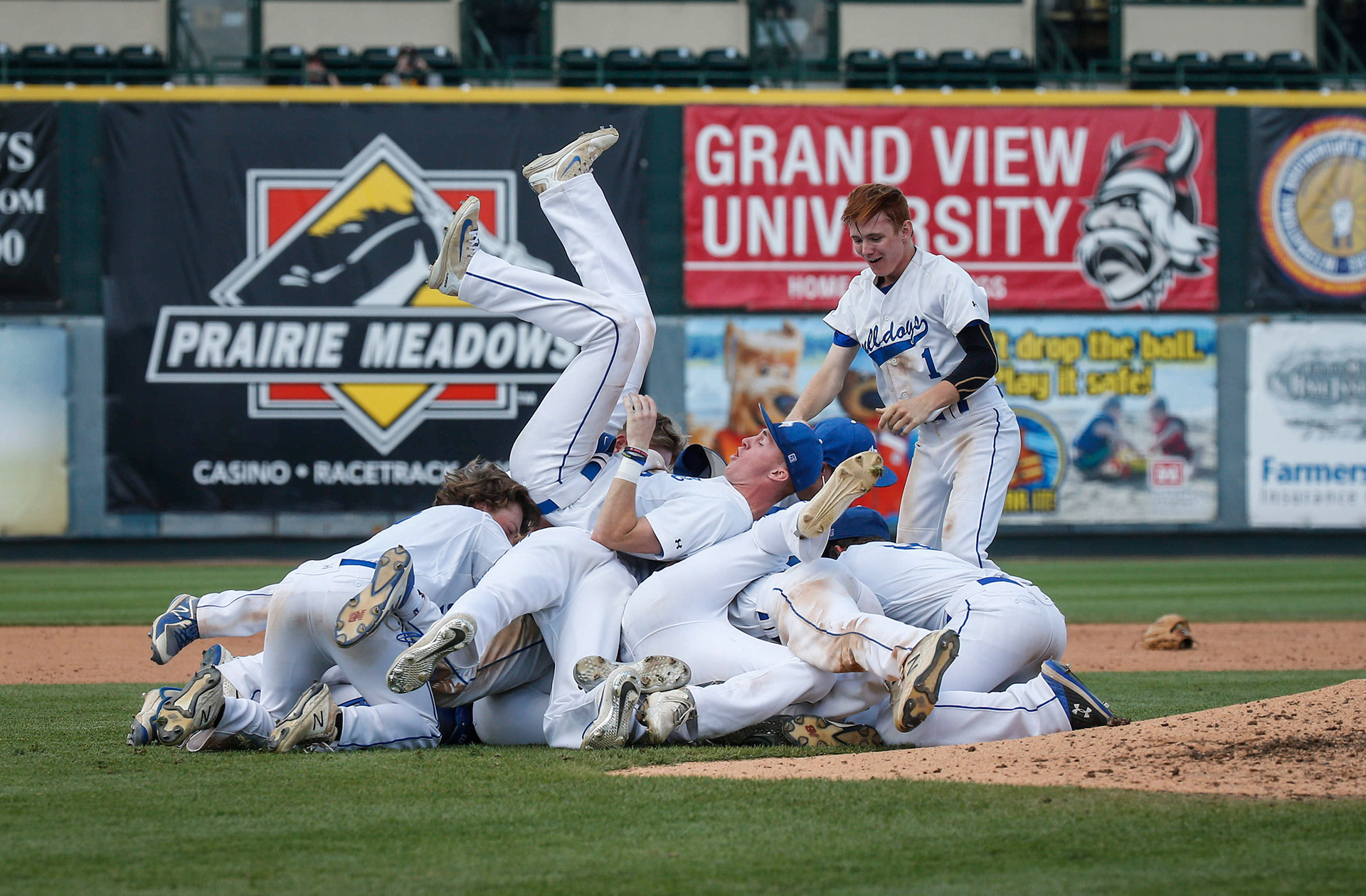 Members of the Van Meter baseball team celebrate a 6-0 win over North Linn in the Iowa Class 2A state baseball championship game on Saturday, Aug. 3, 2019, at Principal Park in Des Moines.