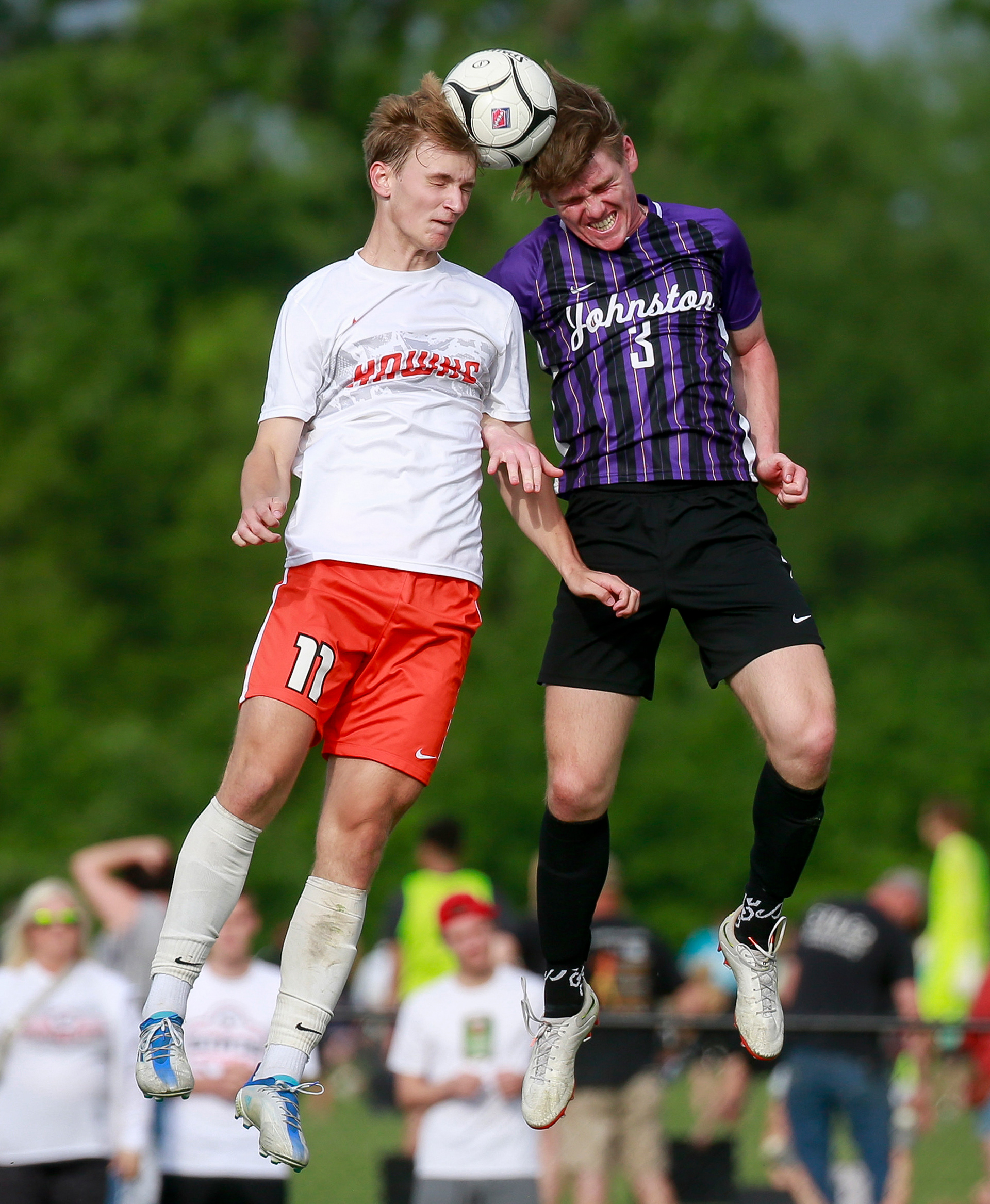 Johnston's Grant Strickler, right, and Cedar Rapids Prairie's Tyler Fear collide as they both head the ball in the first half during the Iowa high school boys state soccer tournament at Cownie Soccer Complex in Des Moines on Wednesday, June 1, 2022.