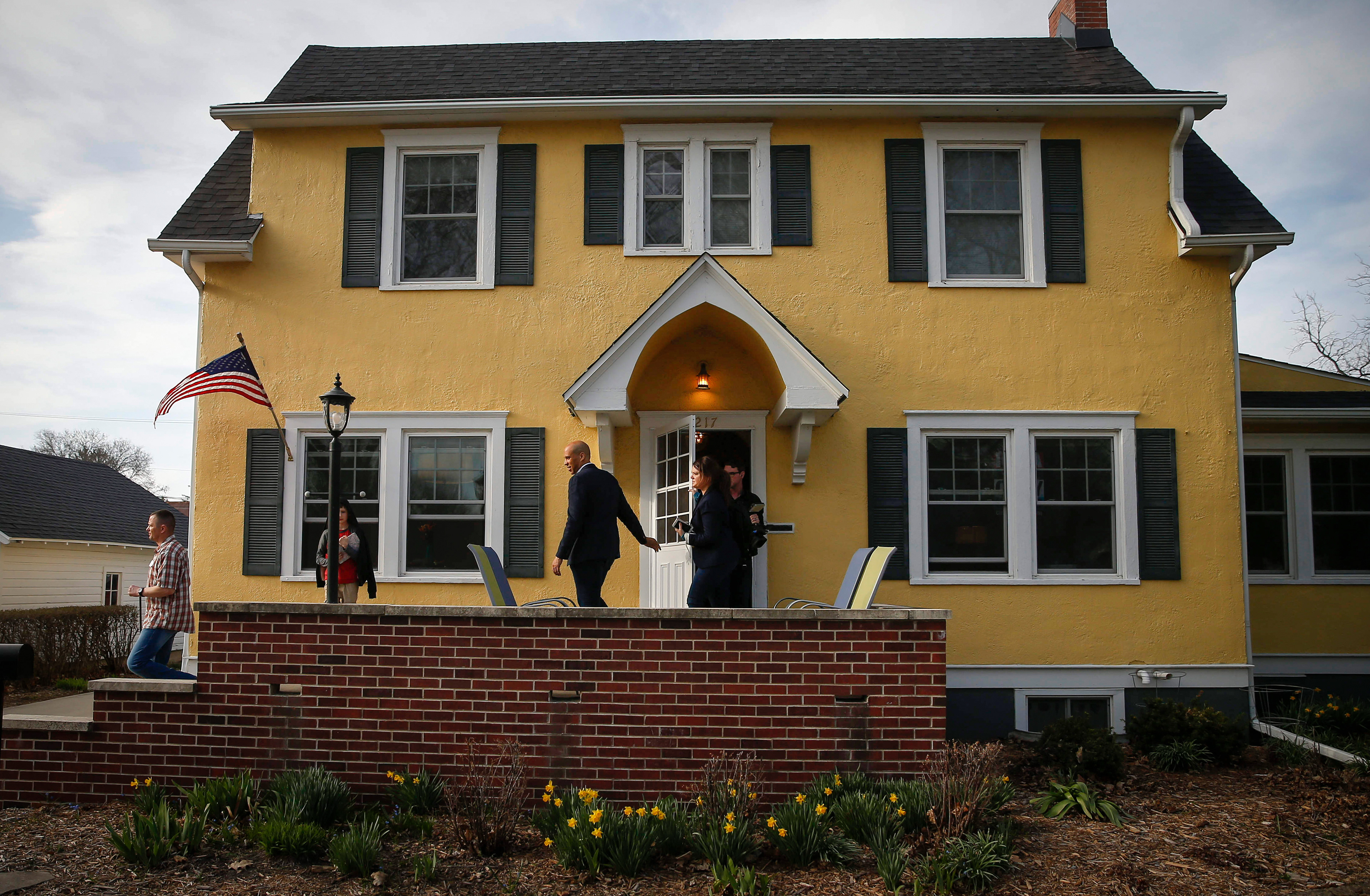 U.S. Senator and democratic presidential candidate hopeful Cory Booker exits a home after speaking to supporters in Nevada on Tuesday, April 16, 2019. 