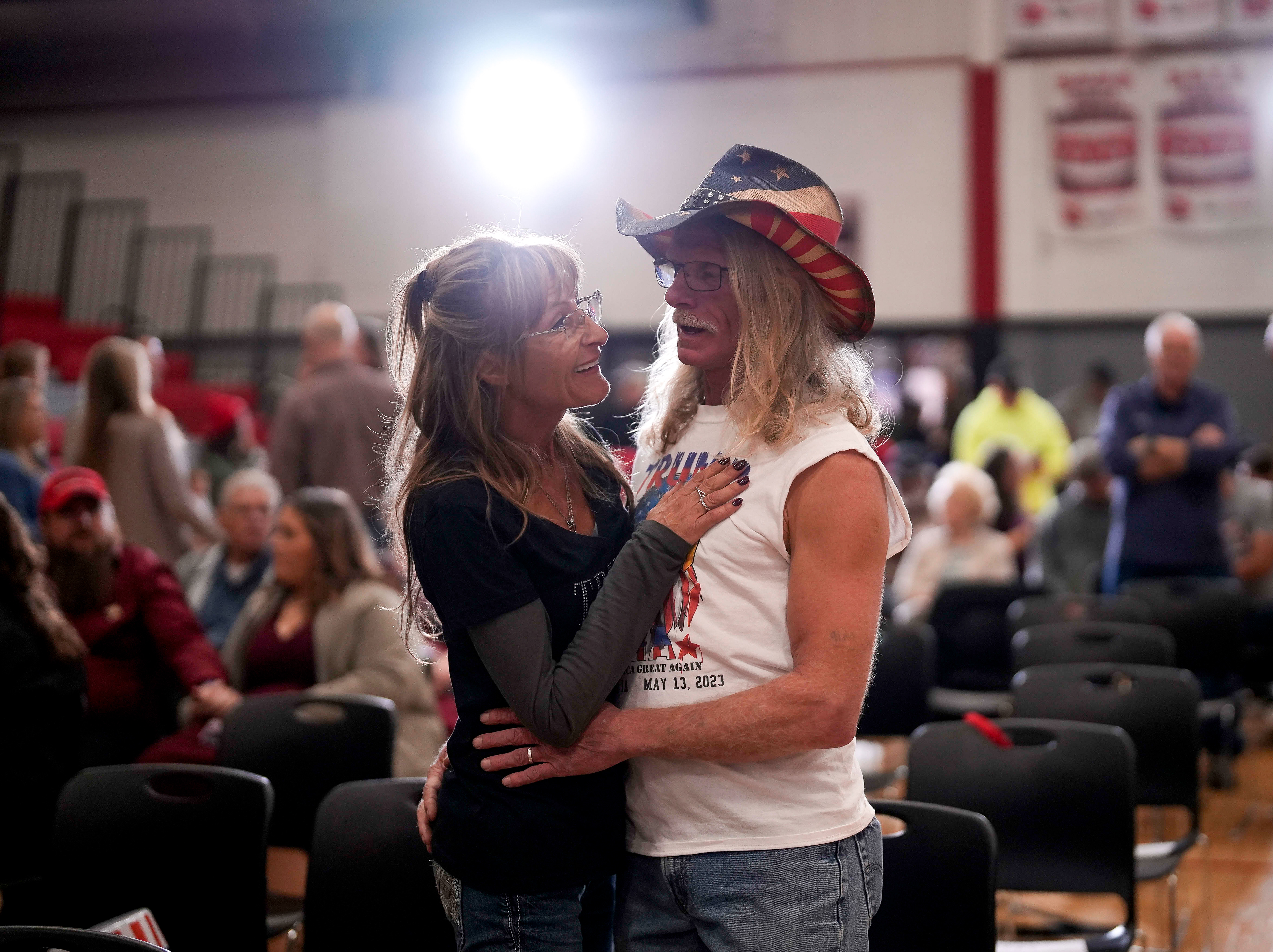 Jim and Sandy Pamperin, newlyweds from North St. Paul, Minn., drove to Iowa to hear Republican presidential candidate and former president Donald Trump speak during a rally Saturday, Nov. 18, 2023, in Fort Dodge, Iowa. (AP Photo/Bryon Houlgrave)