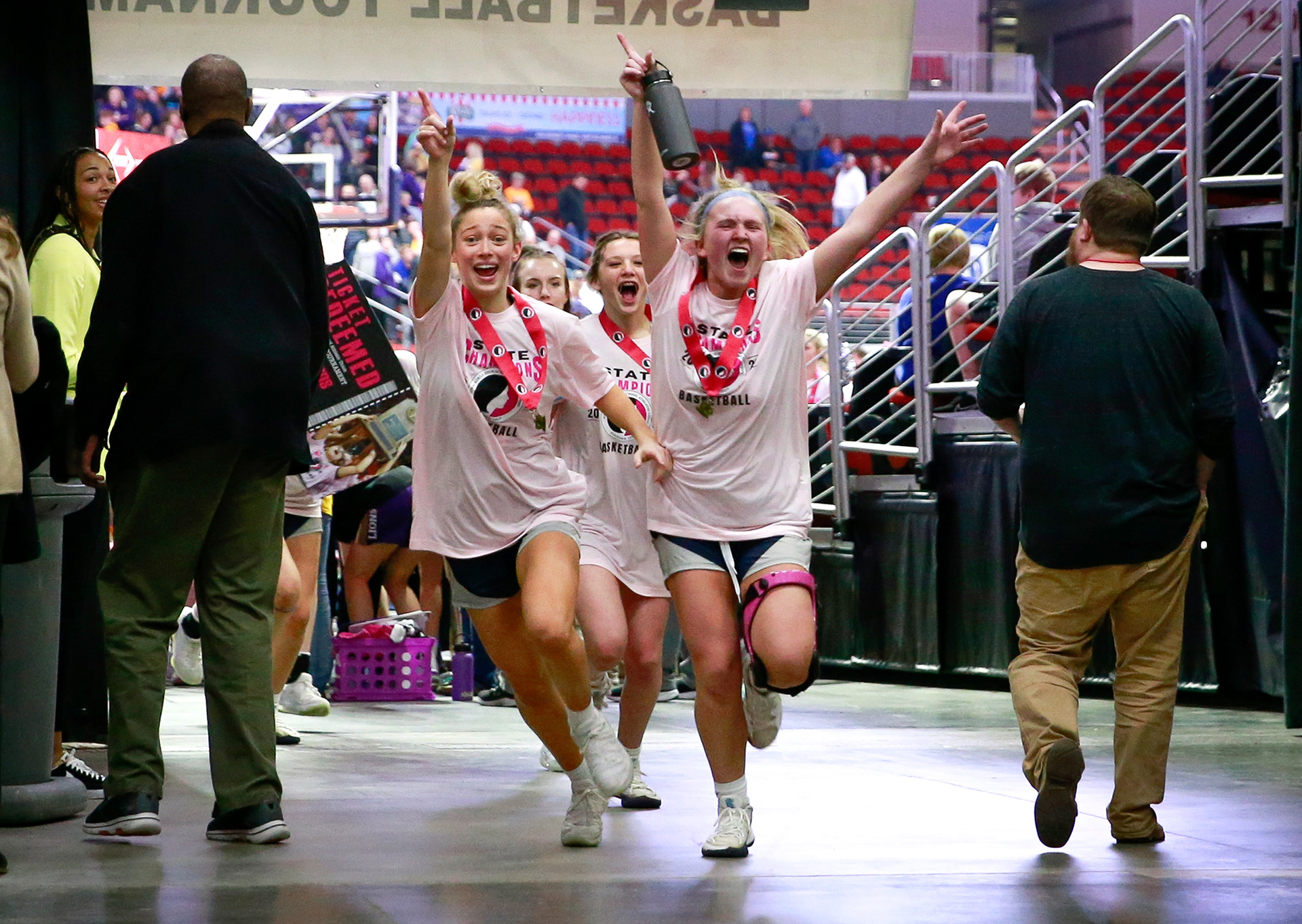 Members of the Cedar Rapids Xavier girls basketball team celebrate after beating Bishop Heelan during the Class 4A girls state basketball championship game at Wells Fargo Arena in Des Moines on Saturday, March 5, 2022.