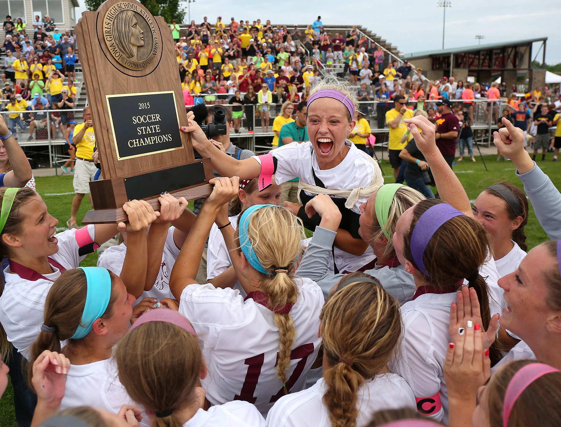 Members of the Ankeny girls soccer team lift Members of the Ankeny girls soccer team lift senior Kelsey Laughman as they take the championship trophy after an overtime win over Pleasant Valley during the Iowa Class 2A state soccer championship match at Cownie Sports Complex in Des Moines on Saturday, June 13, 2015.senior Kelsey Laughman as they take the championship trophy after an overtime win over Pleasant Valley during the Iowa Class 2A state soccer championship match at Cownie Sports Complex in Des Moines on Saturday, June 13, 2015.