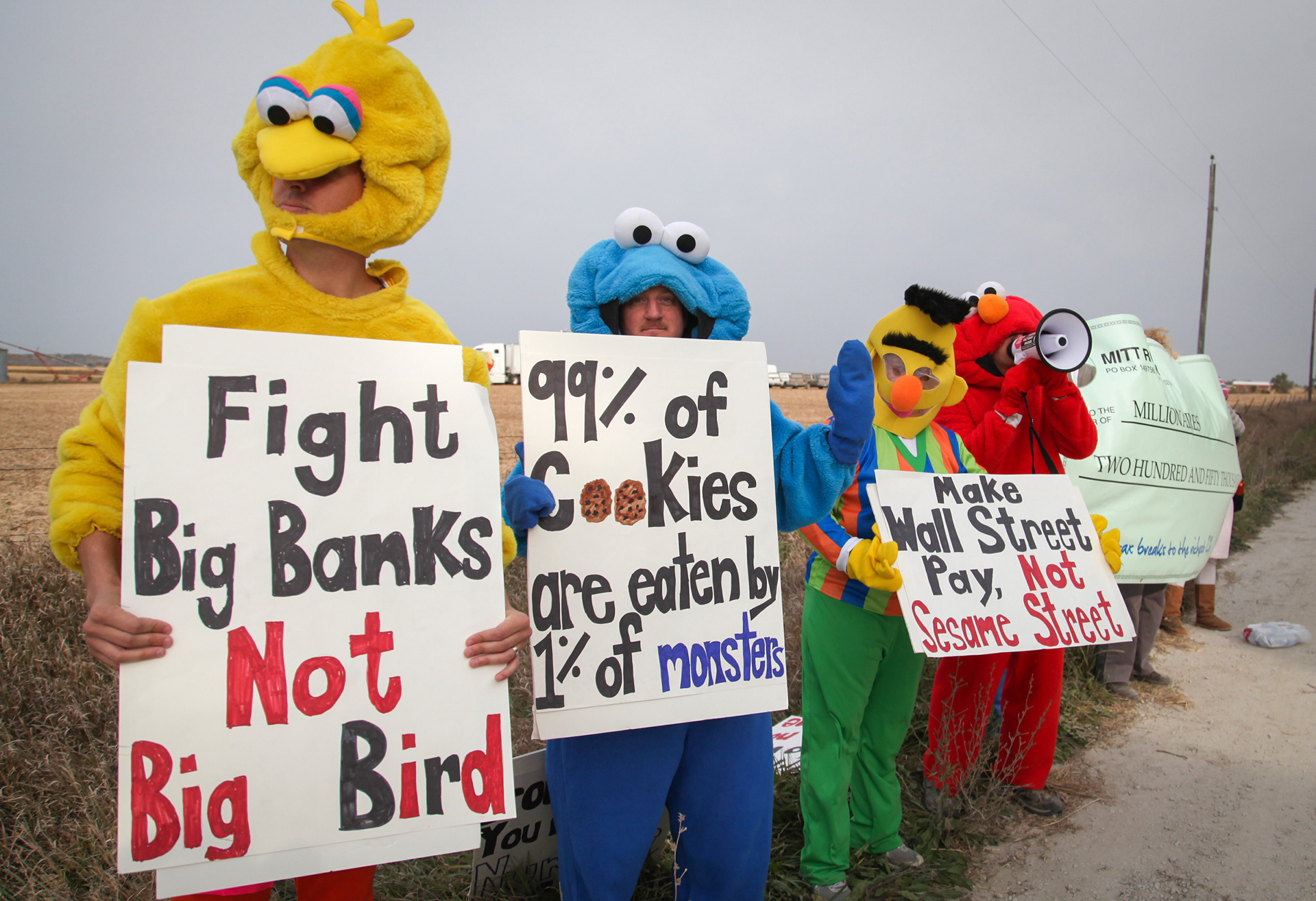 Members of the CCI group dressed as Sesame Street characters and protested Mitt Romney's visit on Tuesday, Oct. 9, 2012, during a campaign stop in Van Meter, Iowa. 