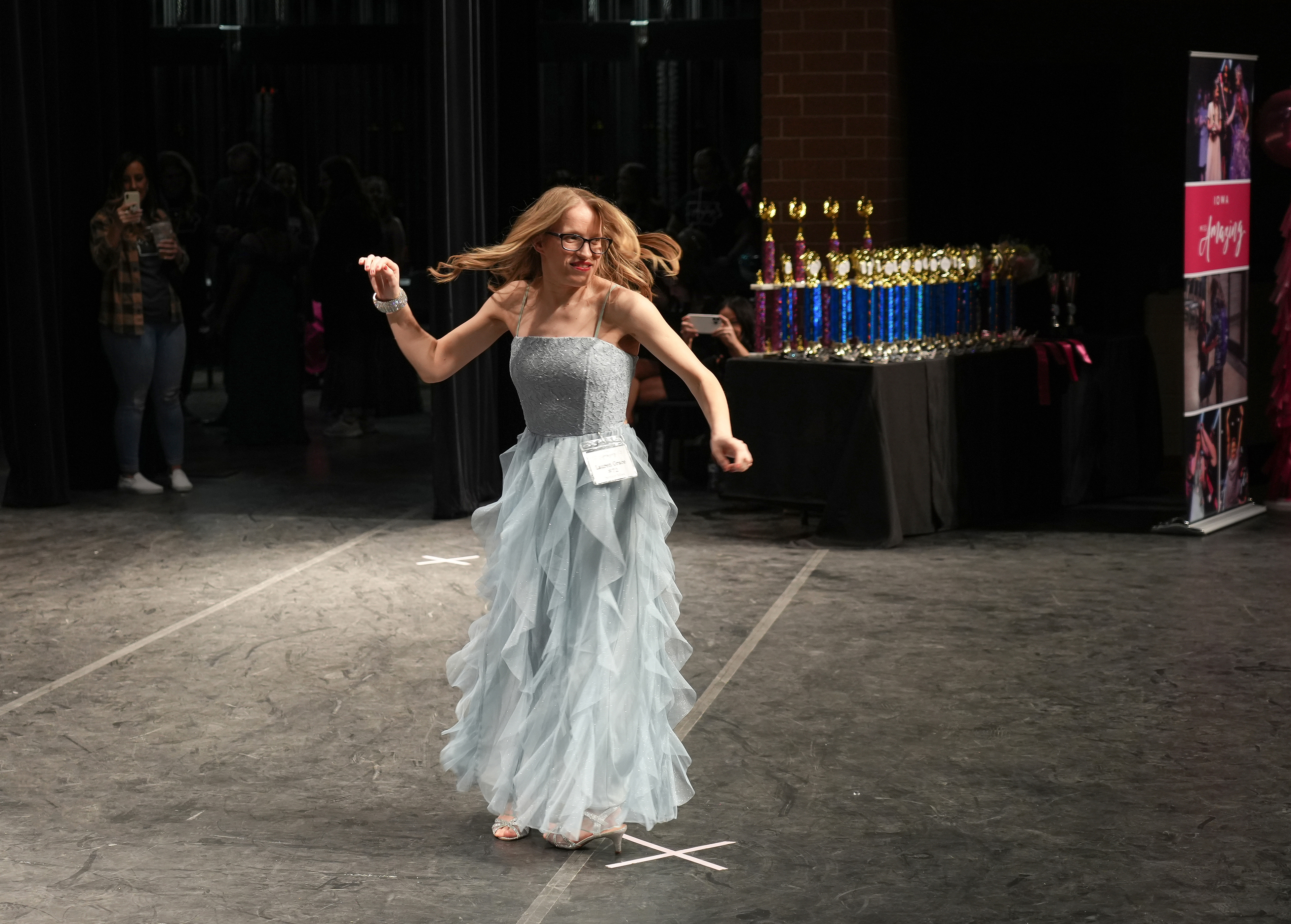 Iowa Miss Amazing senior miss participant Lauren Grace twirls in her gown during the 11th Annual Iowa Miss Amazing pageant on Saturday, Feb. 4, 2023, in Urbandale, Iowa.