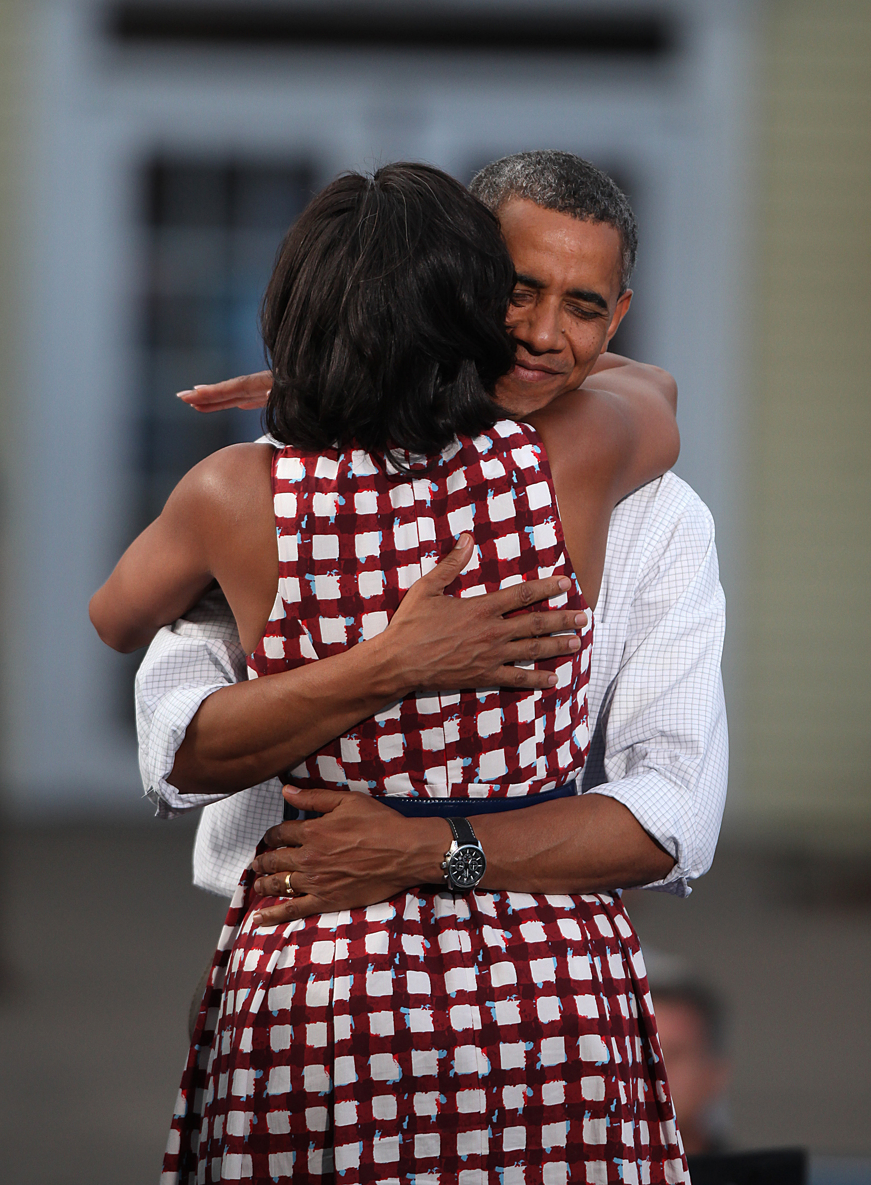 President Barack Obama and First Lady Michelle Obama greet the crowd of 3,000 supporters in downtown Davenport, Iowa, on Wednesday, Aug. 15, 2012. 