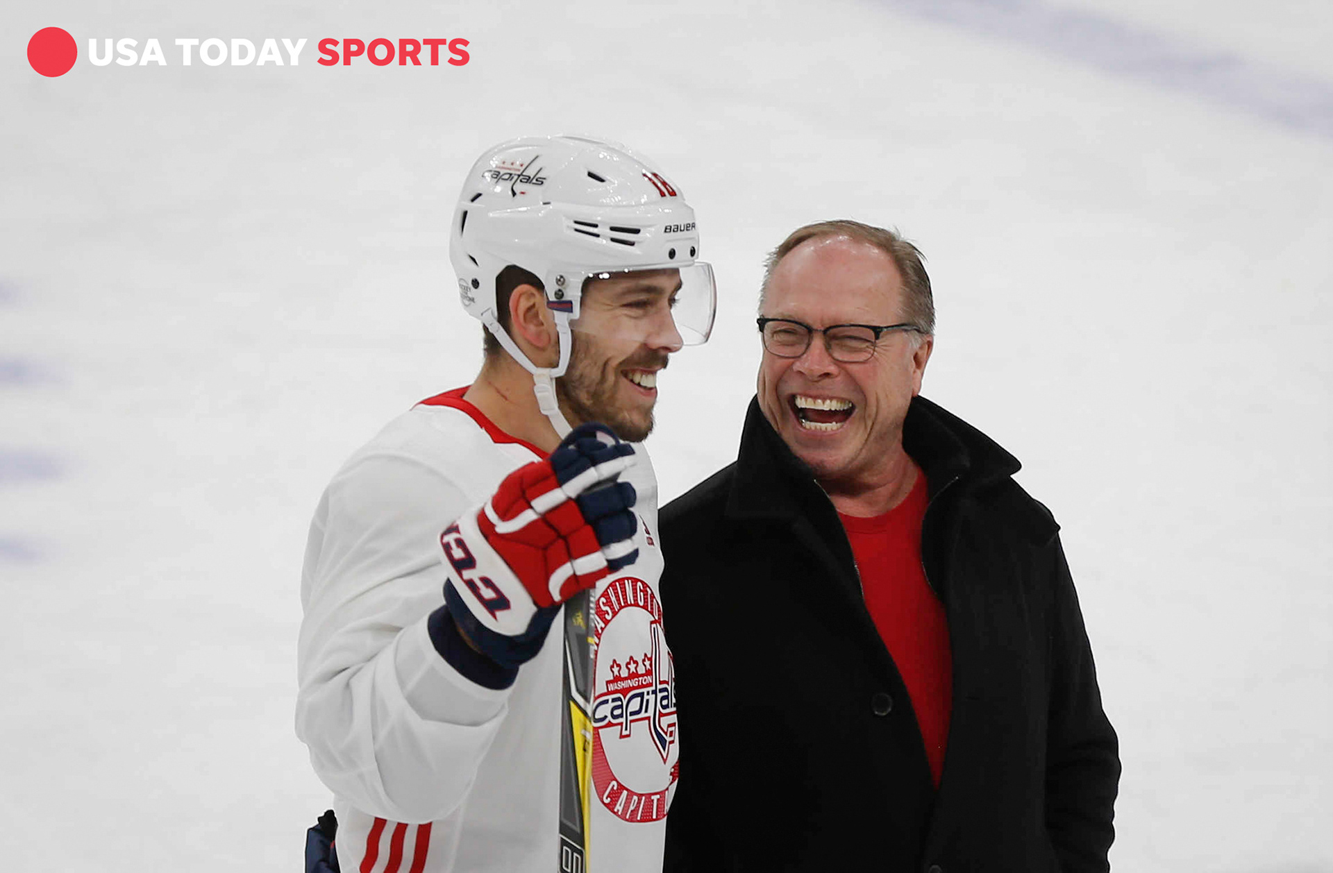 Washington Capitals center Chandler Stephenson visits with his father, Curt, on the ice at the United Center on Friday, Feb. 16, 2018, in Chicago, Illinois, during the 2018 Mentors' Trip.