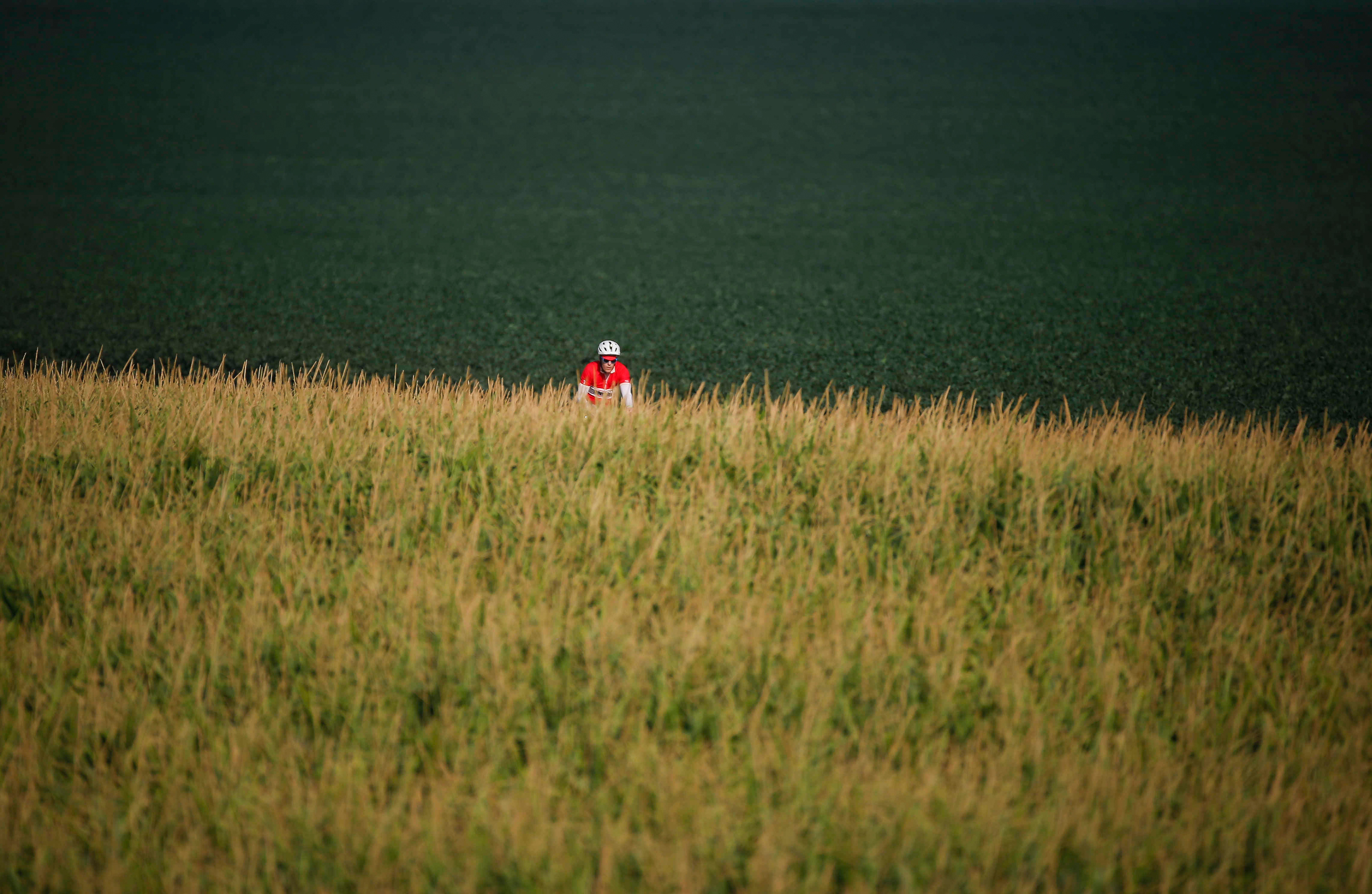 Cyclists make their way along the optional gravel loop into Webster City on the RAGBRAI route on Tuesday, July 27, 2021.