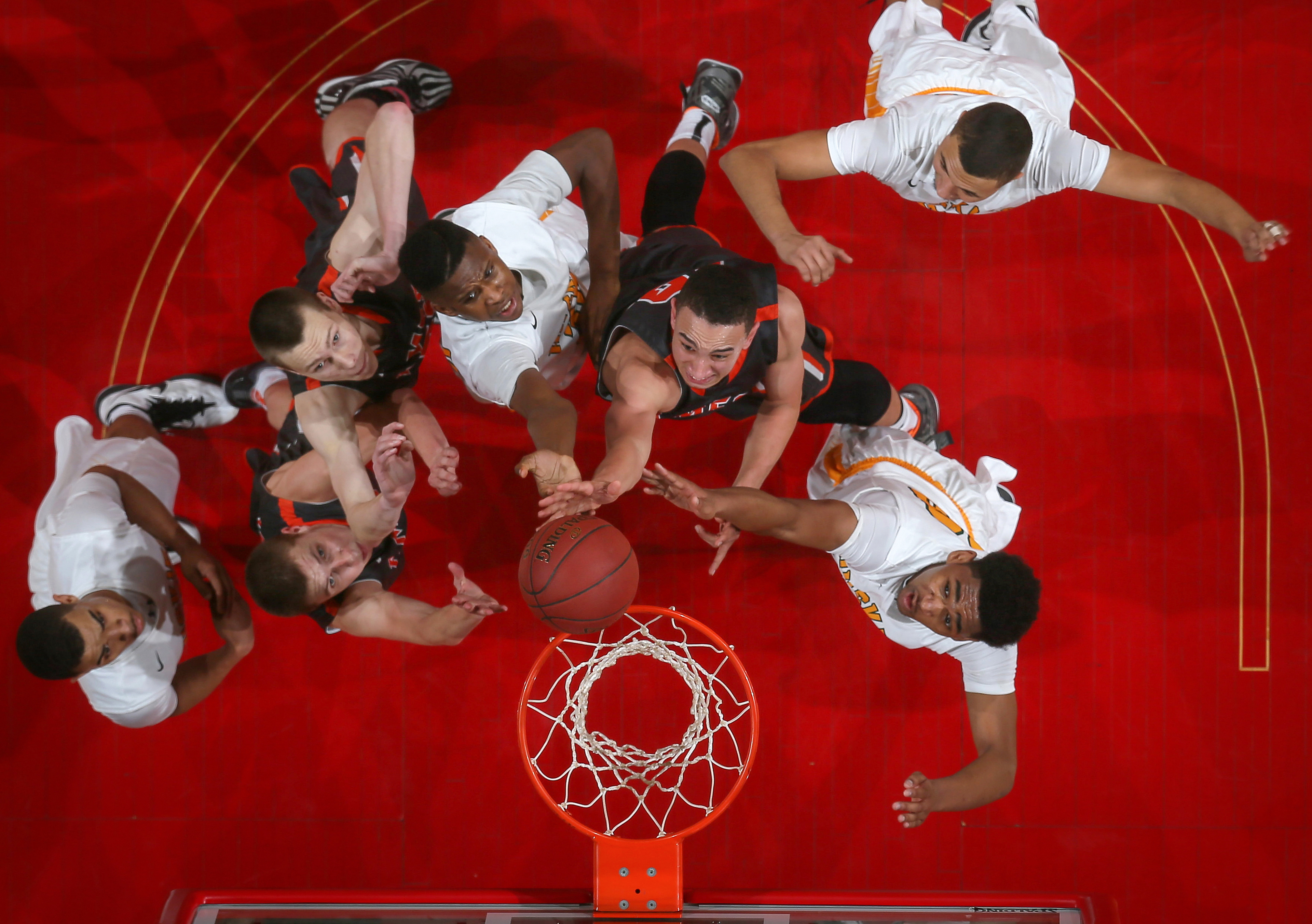Ames senior Javan White cuts through the Hoover defense en route to the basket for a field goal on Wednesday, March 11, 2015, at Wells Fargo Arena in Des Moines, Iowa. 