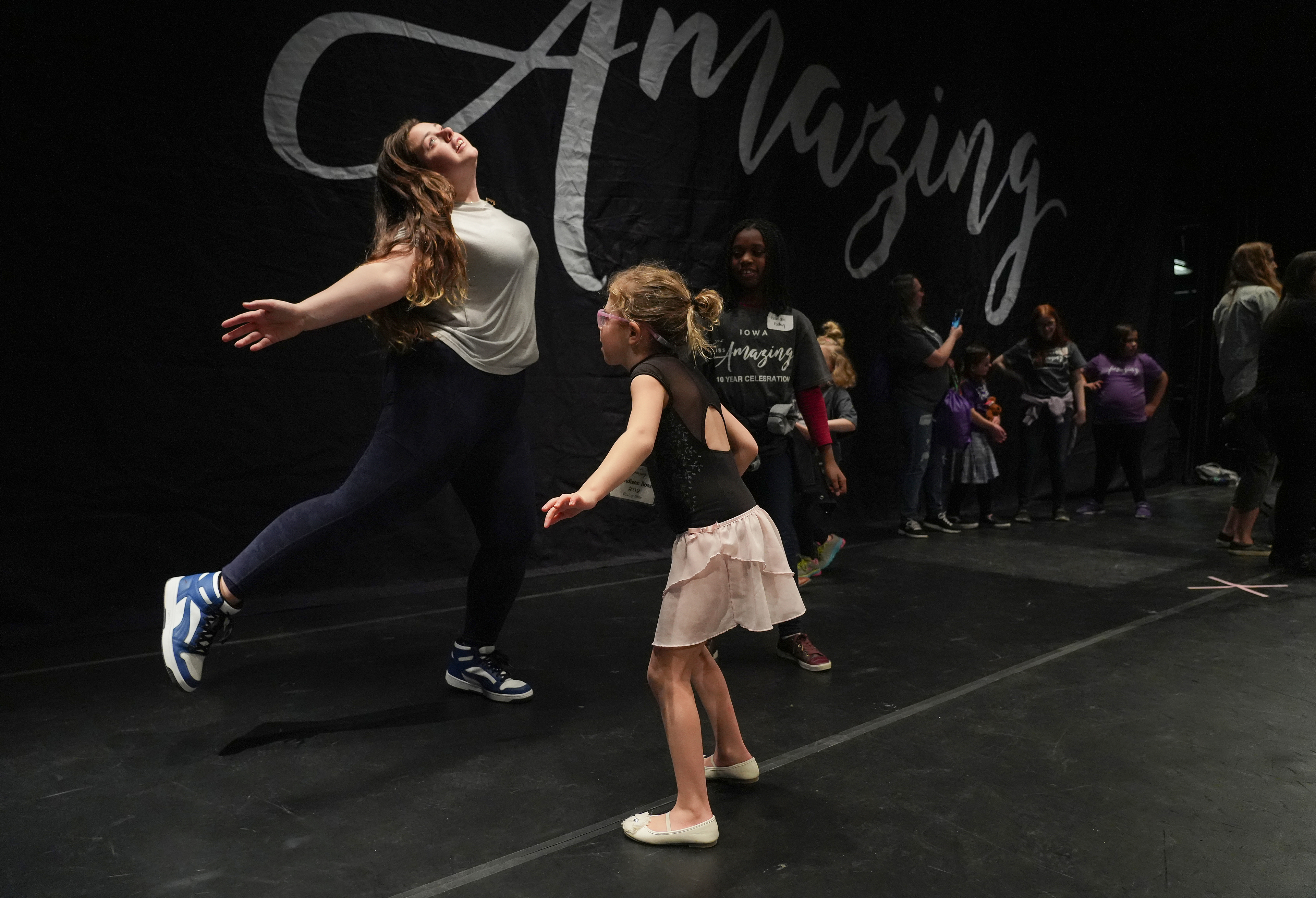 Iowa Miss Amazing rising star participant Madison Ross warms up prior to her passion presentation during the 11th Annual Iowa Miss Amazing pageant on Saturday, Feb. 4, 2023, in Urbandale, Iowa.