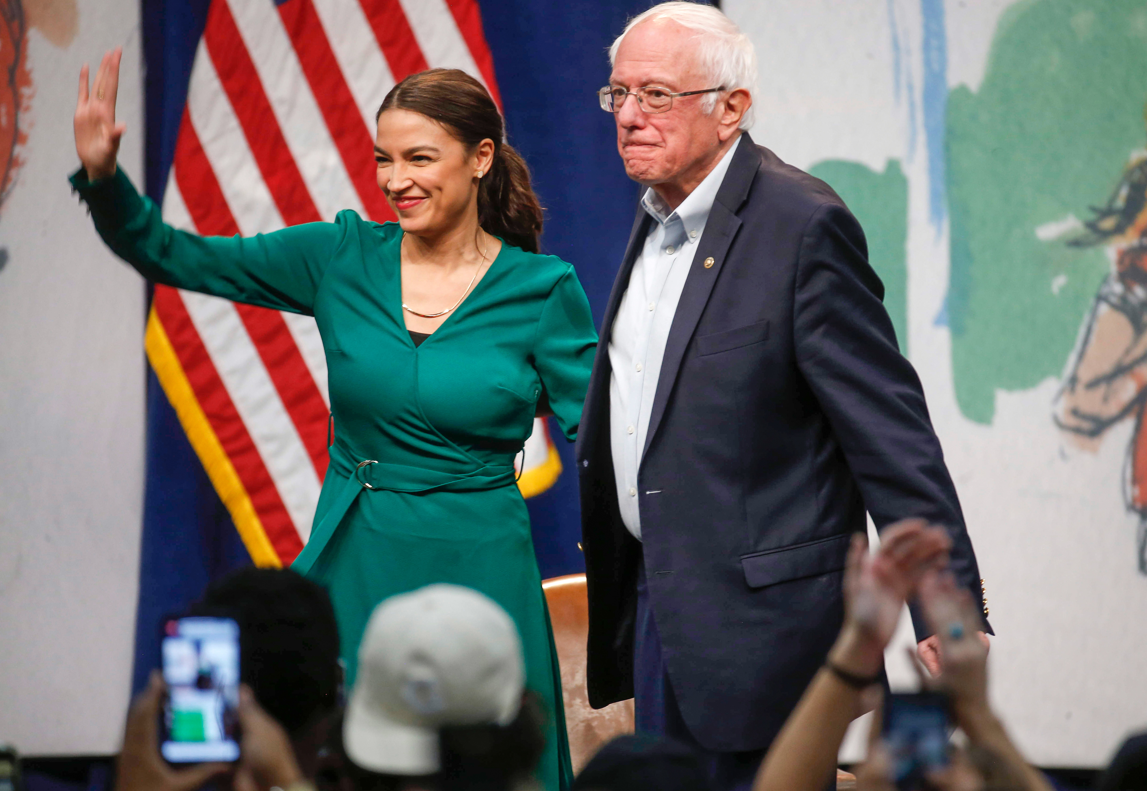Sen. Bernie Sanders, a current Democratic presidential candidate hopeful, stands alongside U.S. Rep. Alexandria Ocasio-Cortez (D-NY) on Saturday, Nov. 9, 2019, at Drake University in Des Moines.