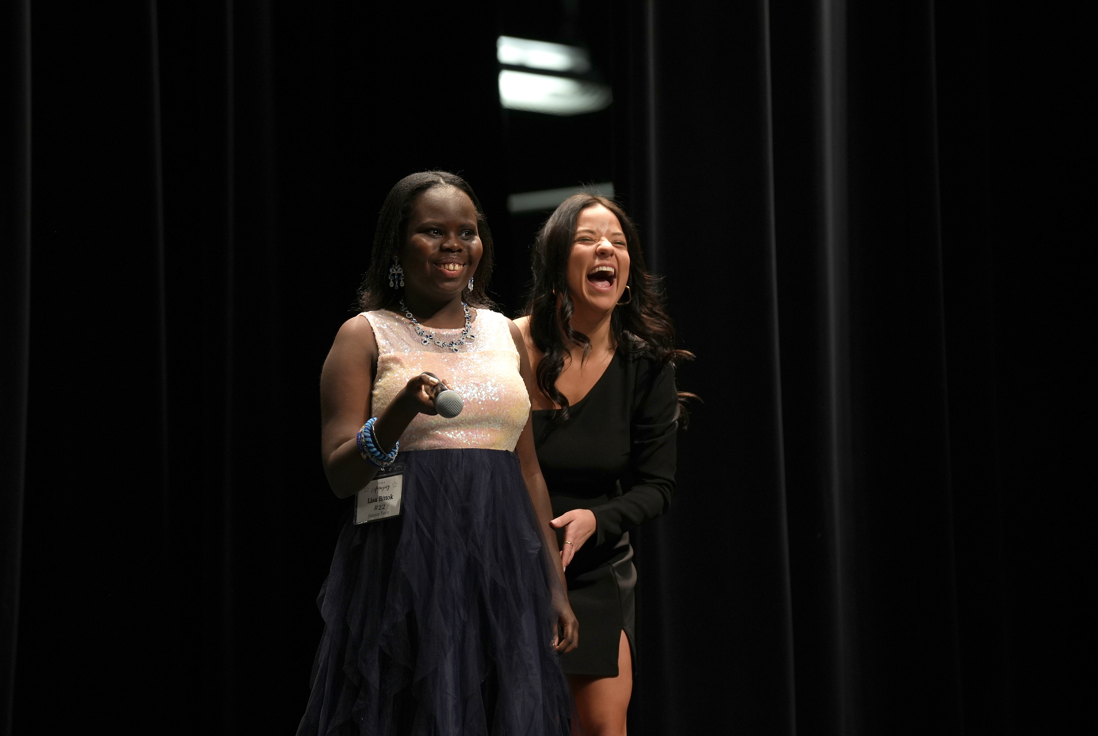 Iowa Miss Amazing junior teen participant Lisa Bittok, left, gets a laugh from Iowa Miss Amazing co-director Morgan Tooley during the 11th Annual Iowa Miss Amazing pageant on Saturday, Feb. 4, 2023, in Urbandale, Iowa.