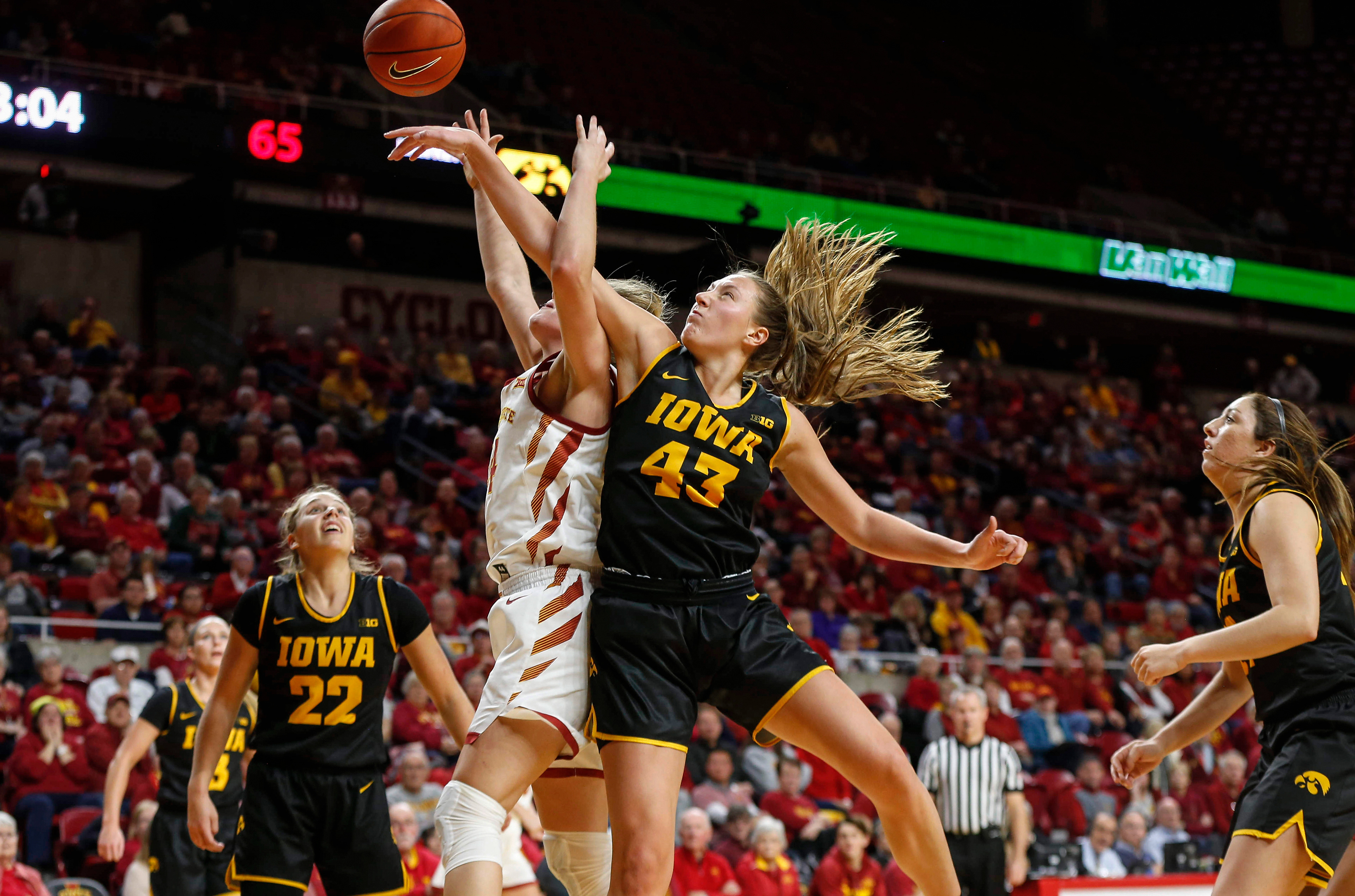 Iowa senior Amanda Ollinger is called for a foul after knocking the ball away from Iowa State sophomore Ashley Joens during the CyHawk Series women's basketball game on Wednesday, Dec. 11, 2019, at Hilton Coliseum in Ames, Iowa.