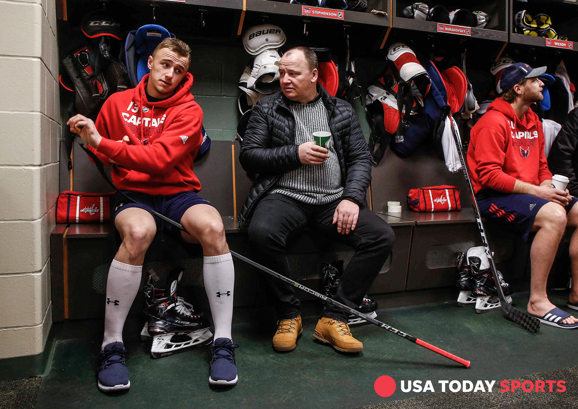 Washington Capitals left wing Jakub Vrana tapes his stick while visiting with his father, Karl, on Thursday, Feb. 15, 2018, in St. Paul, Minn., during the team's 2018 Mentors' Trip.