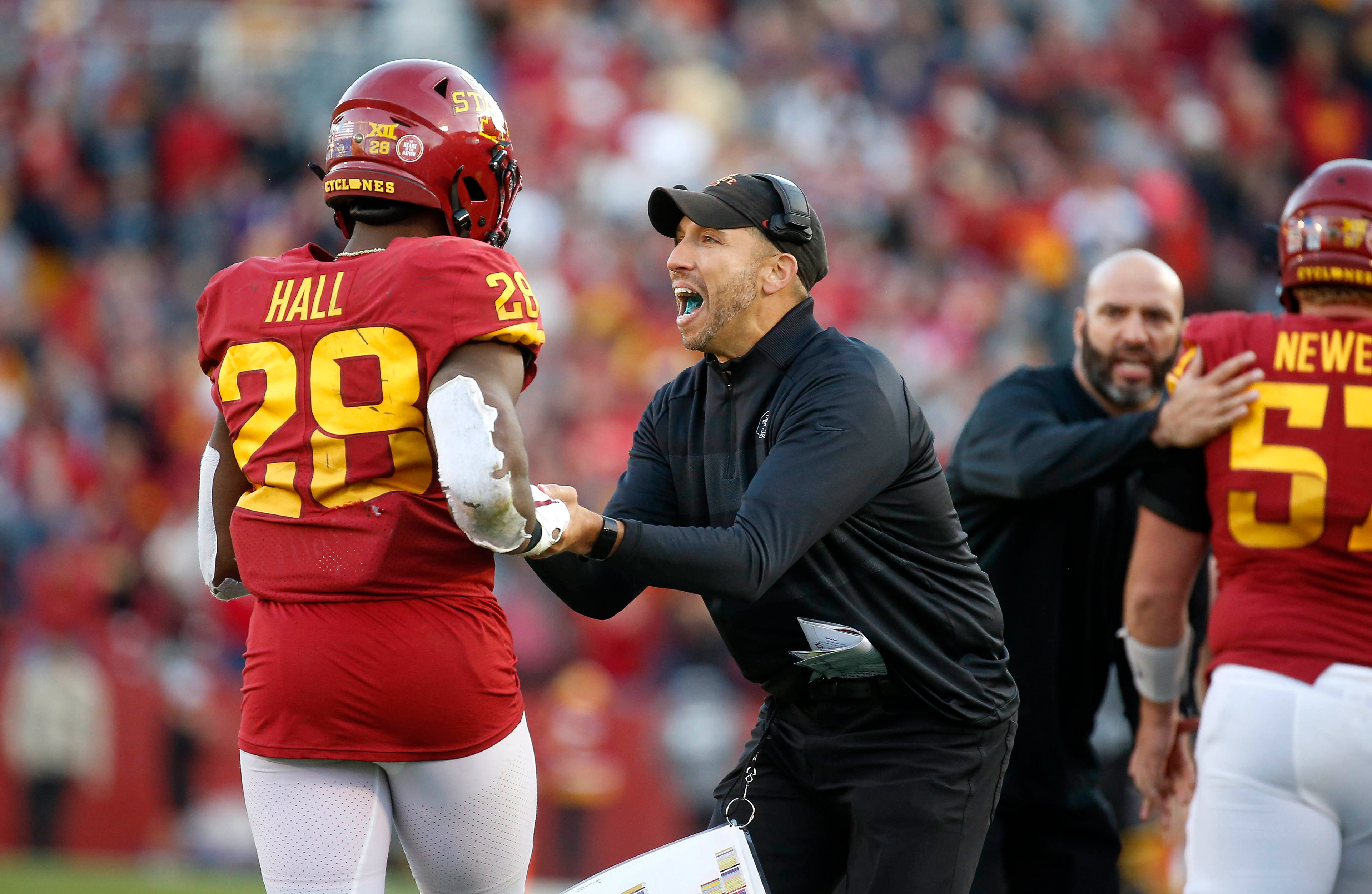 Iowa State head football coach Matt Campbell celebrates with running back Breece Hall after Hall scored a touchdown in the fourth quarter to help the Cyclones upset No. 8-ranked Oklahoma State on Saturday, Oct. 23, 2021, at Jack Trice Stadium in Ames.